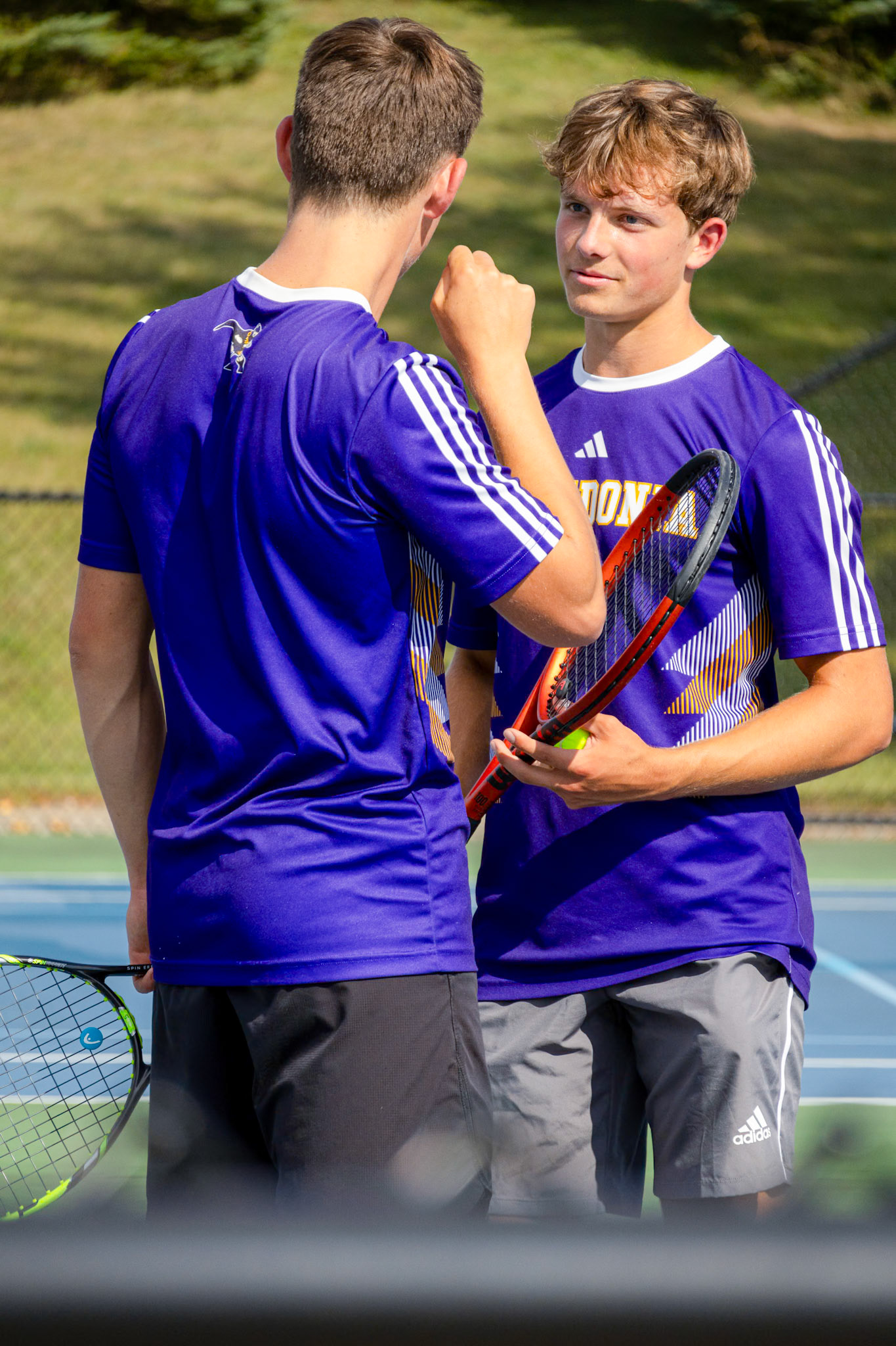 Between points, Derrick Prichard and Caleb Harrison share a quick word. (Photo by Mackenzie Popma)