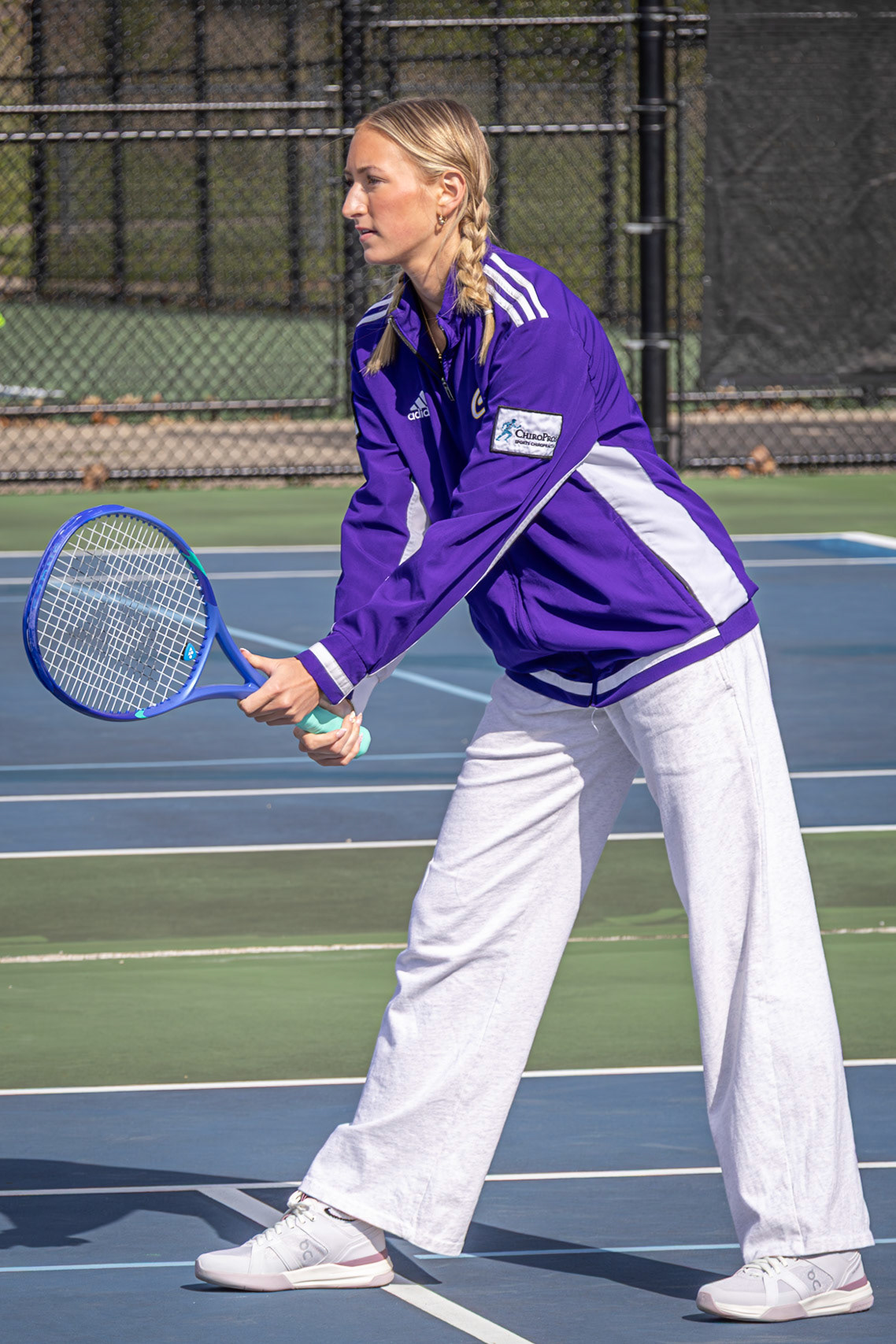 Clarie Anderson stays composed on the court, ready for every serve and every point. (Photo by Mya VanderZwaag)