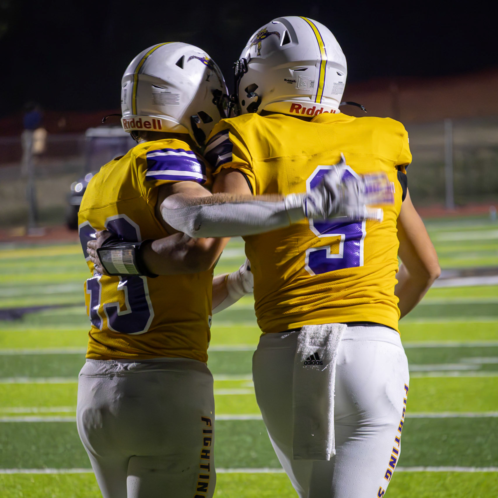Teammates Ryne Wysocki and Conlan Schultz celebrate after the Scots score a touchdown against Grand Haven. (Photo by Taya Penoes)