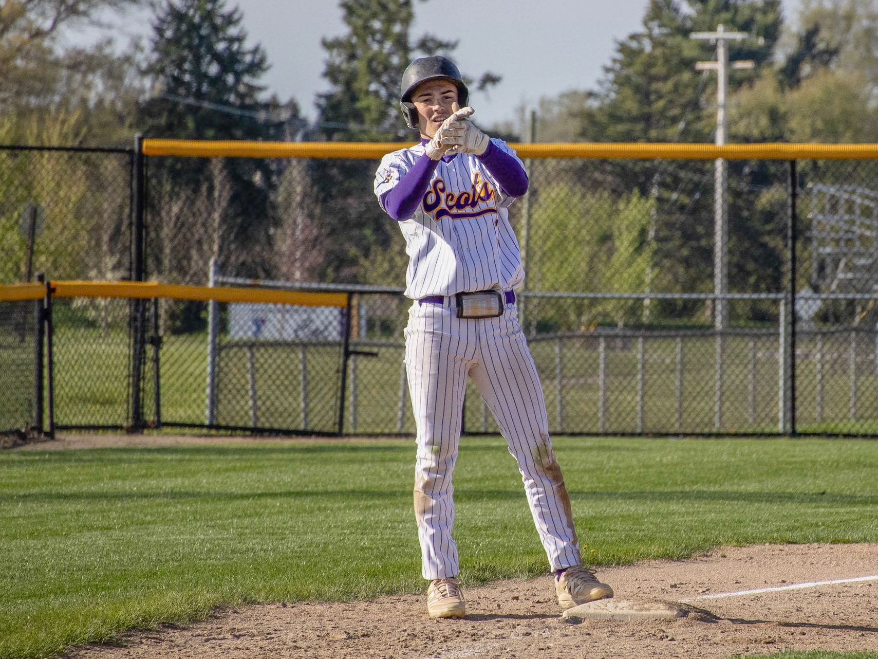 For his third and last at-bat, Jimmy Holmes launches a ball to the fence for a triple. (Photo by Ella-Grace Wickens)