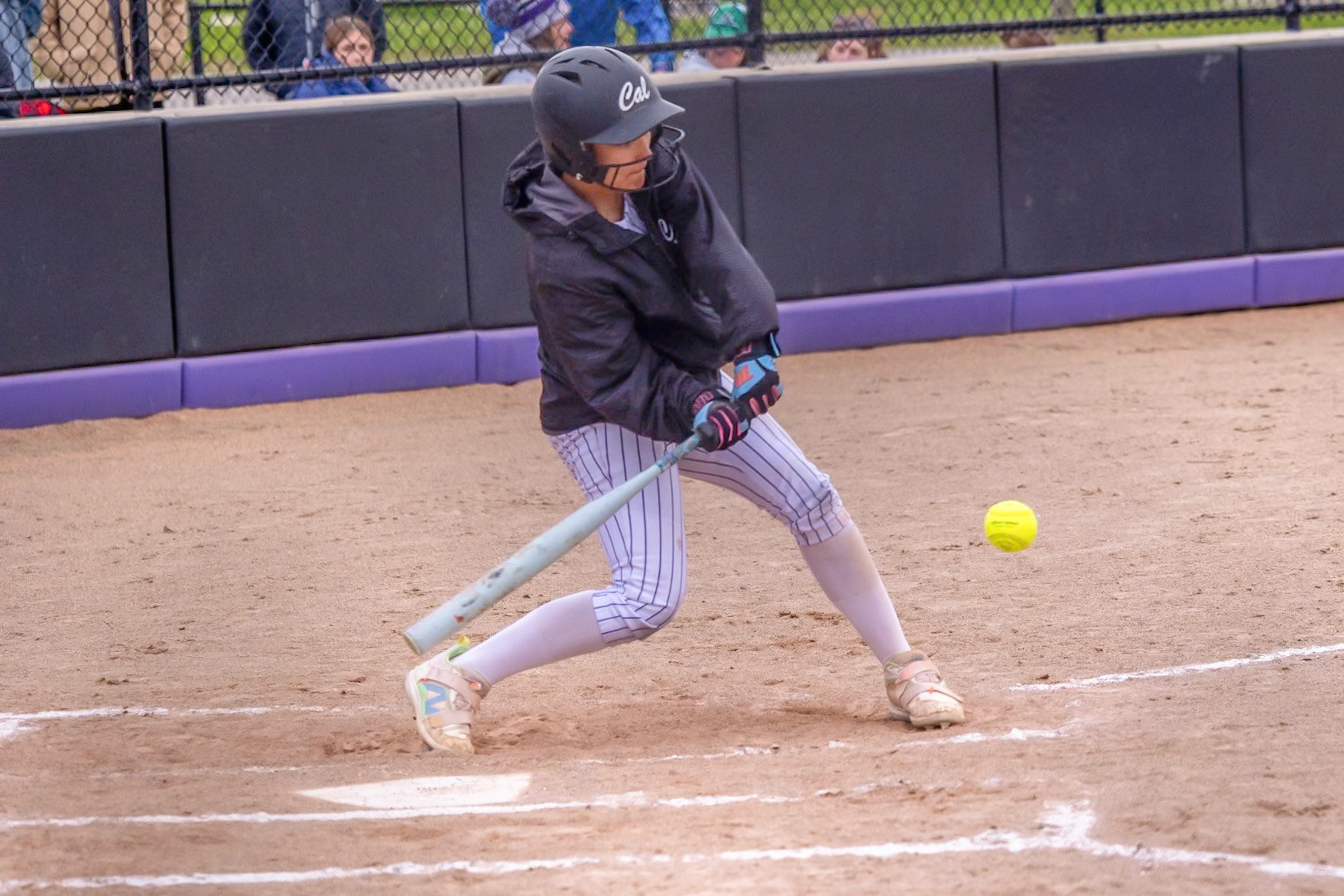 Hudsyn Tanner drives through the swing and puts the ball in play for the Scots. (Photo by Landry Mueller)