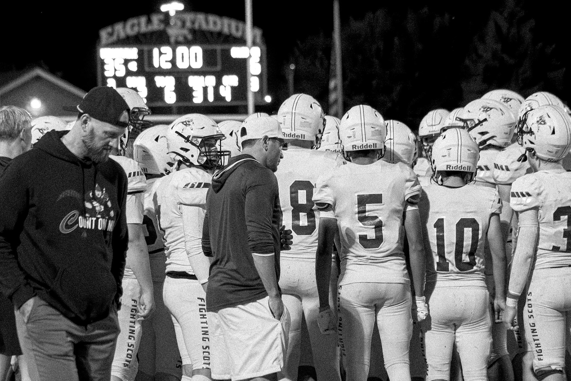Coach hypes up the team, telling them they’re playing well andjust  keep pushing through the last quarter. (Photo by Taya Penoes)