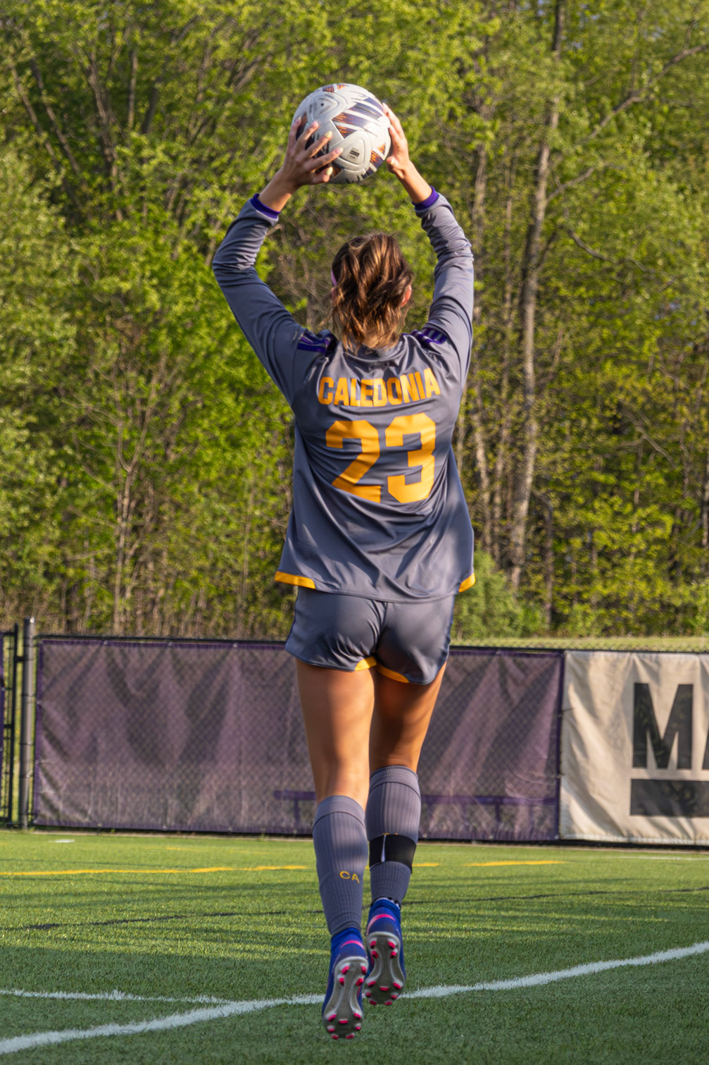 Kayla Briseno launches the ball back into play with a powerful overhead throw from the sideline. (Photo by Ava LaBine)