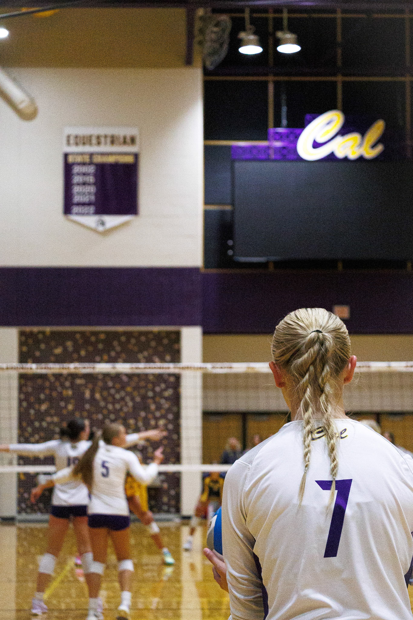 Kyla Charles steps to the back line, steadying herself for a decisive serve. (Photo by Joseph Bawi)