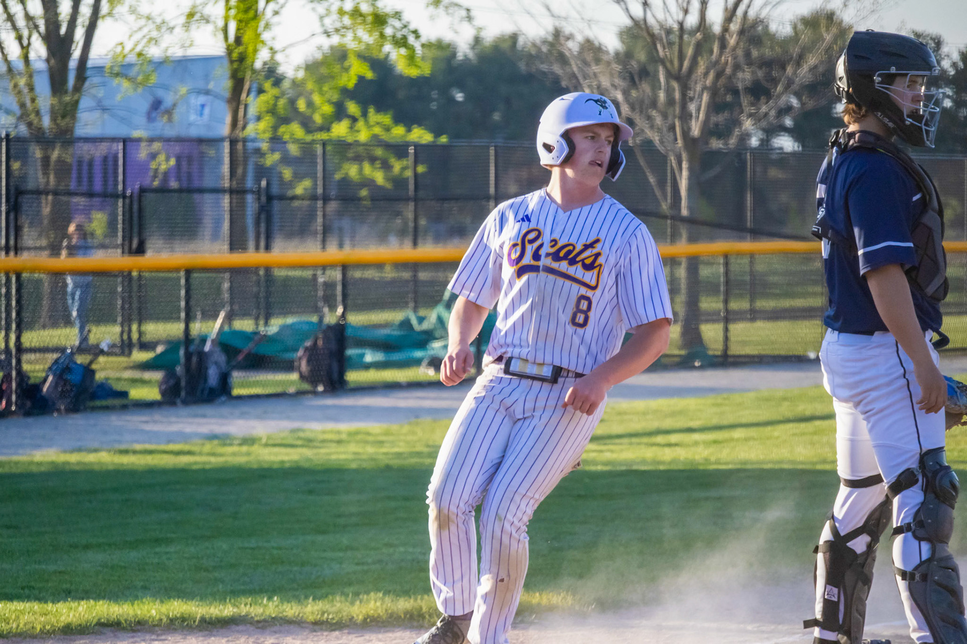 Jogging home after the bases were loaded from a series of walks, Bryce Freese takes his time crossing the plate. (Photo by Ella-Grace Wickens)