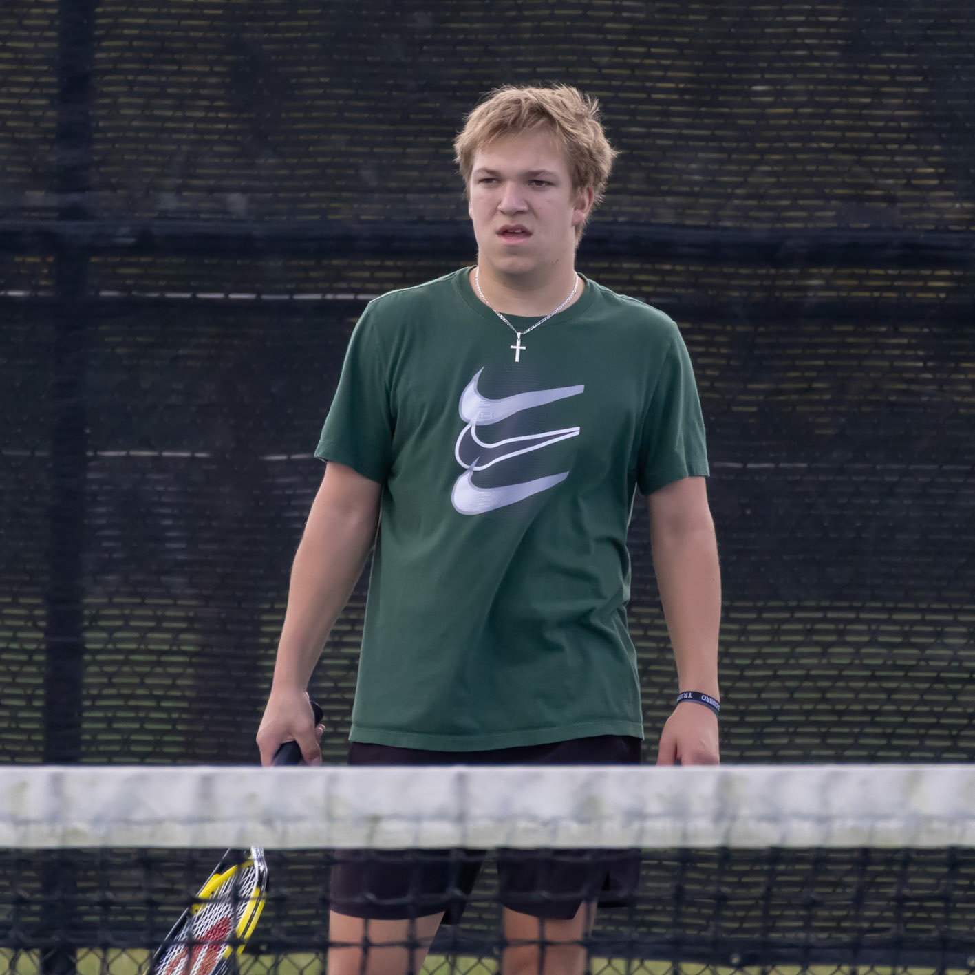 Facing his opponents Tyler Triebel gets his game face on ready to return the ball back over the net. (Photo by Ella-Grace Wickens)