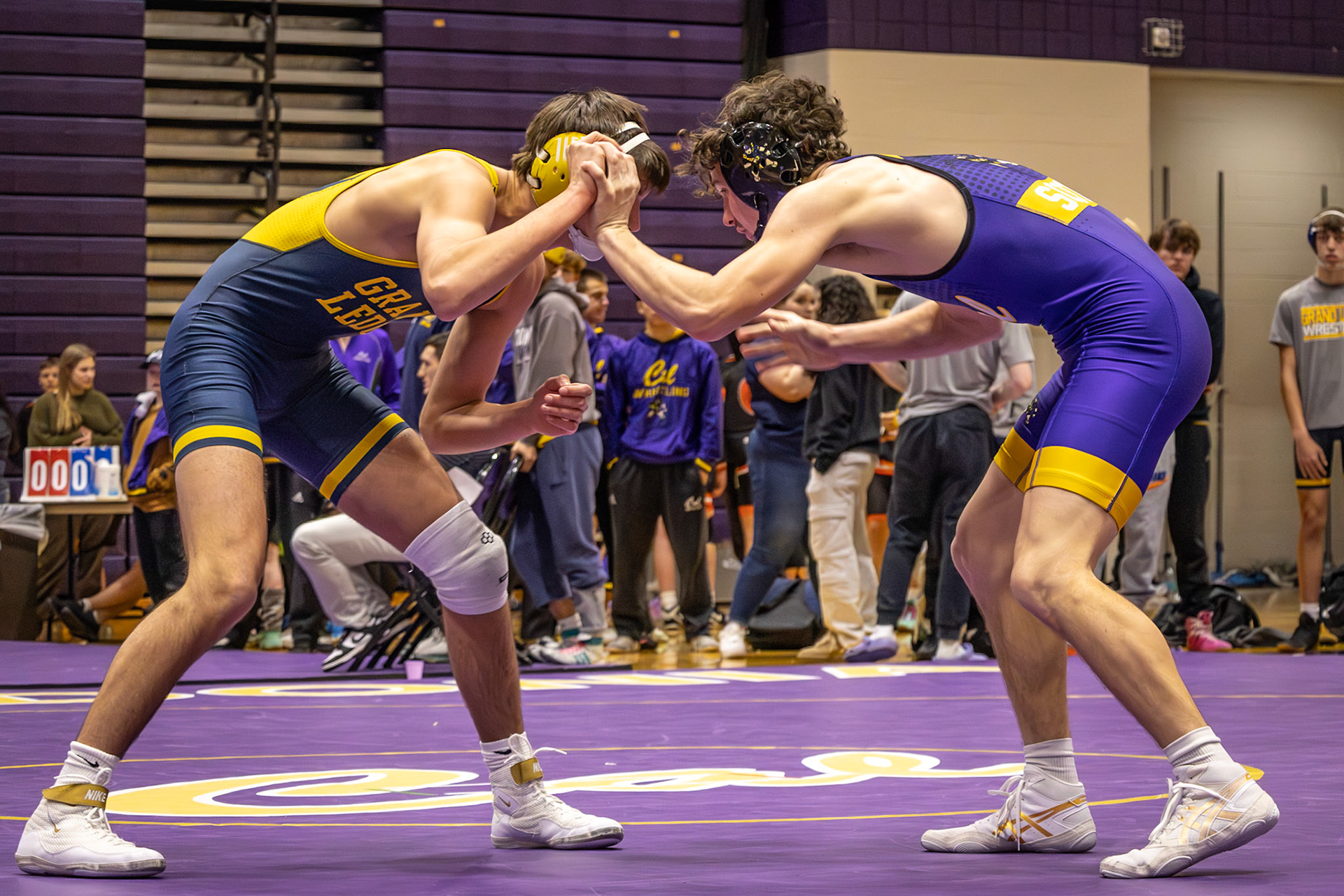 Ben Moss gets into the start of his first match of the night and fights hard for his last year wrestling for the Fighting Scots. (Photo by Rhyan Guzman)