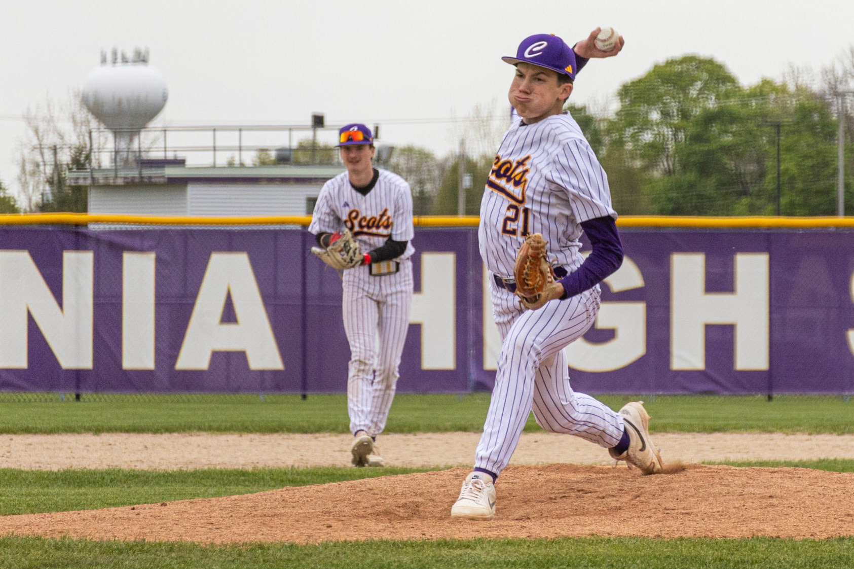 Lincoln Snow stands confidently on the mound during a cold game against Muskegon, delivering his pitch. (Photo by Vivian Hoffman)