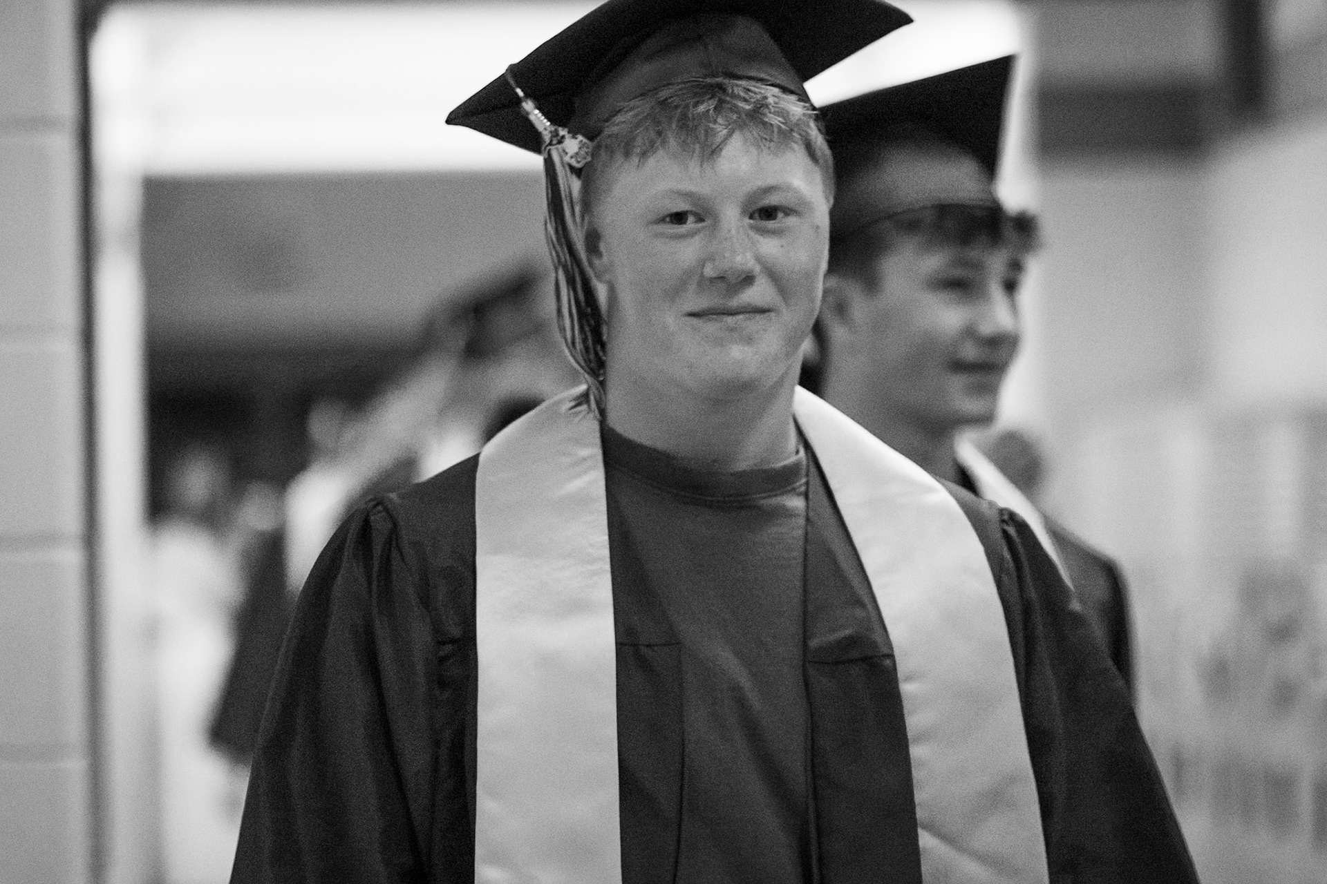 Carter Berends smiles as he passes his old teachers he had when he was younger. (Photo by Emma Garza)
