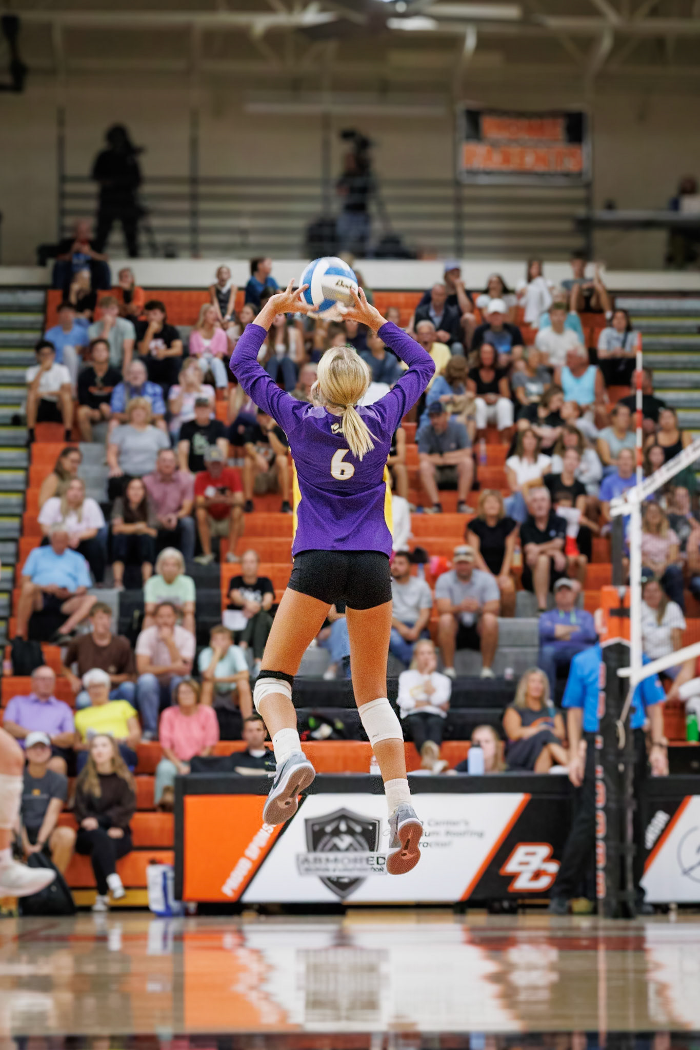 Junior setter Reese Stafford rises high to deliver the perfect set, leading her team with precision and poise. (Photo by Joseph Bawi)