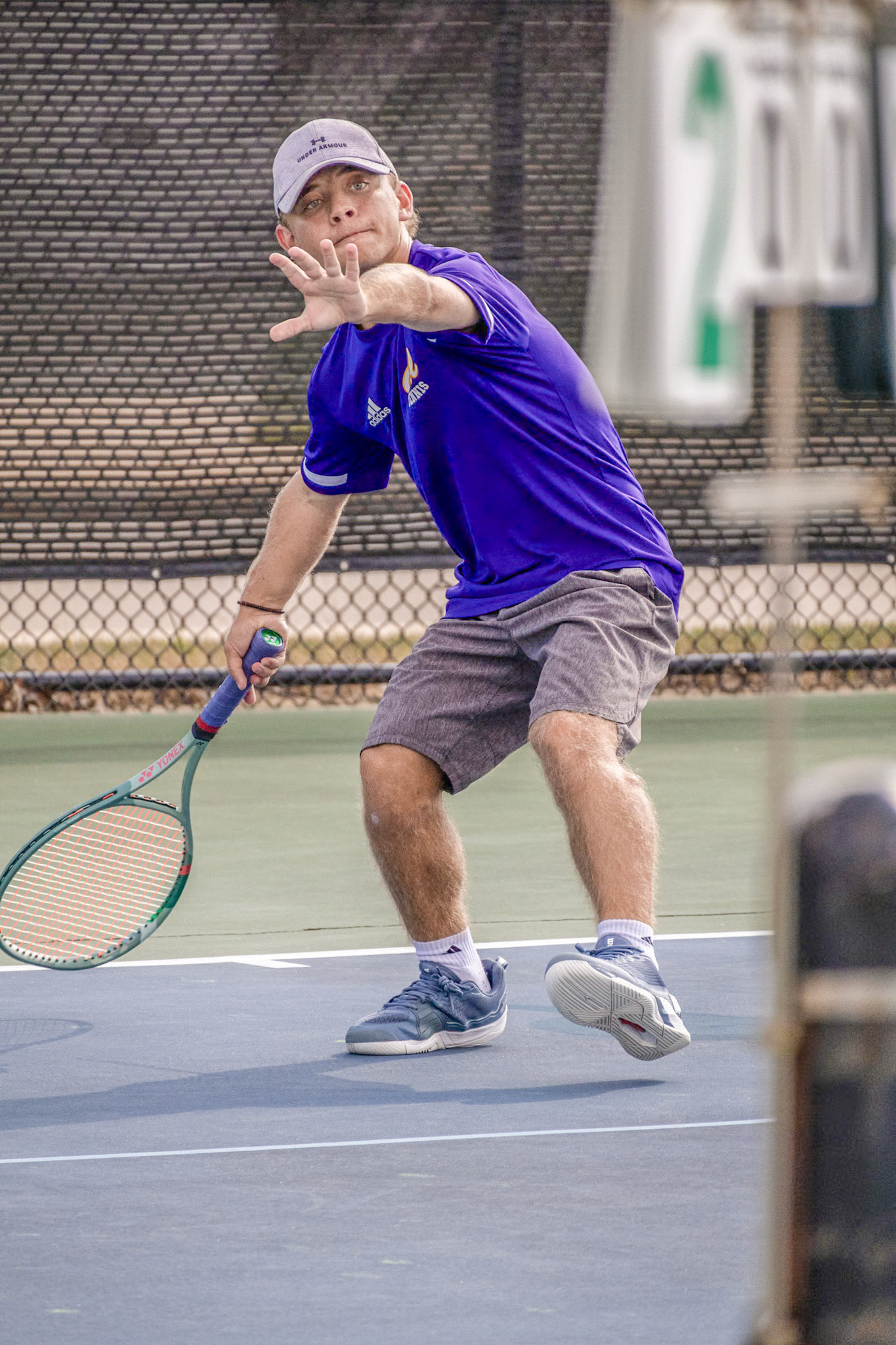 Knees bent and eyes locked on the ball, Hudsen Derengowski demonstrates power starts from focus and precision. (Photo by Mackenzie Popma)