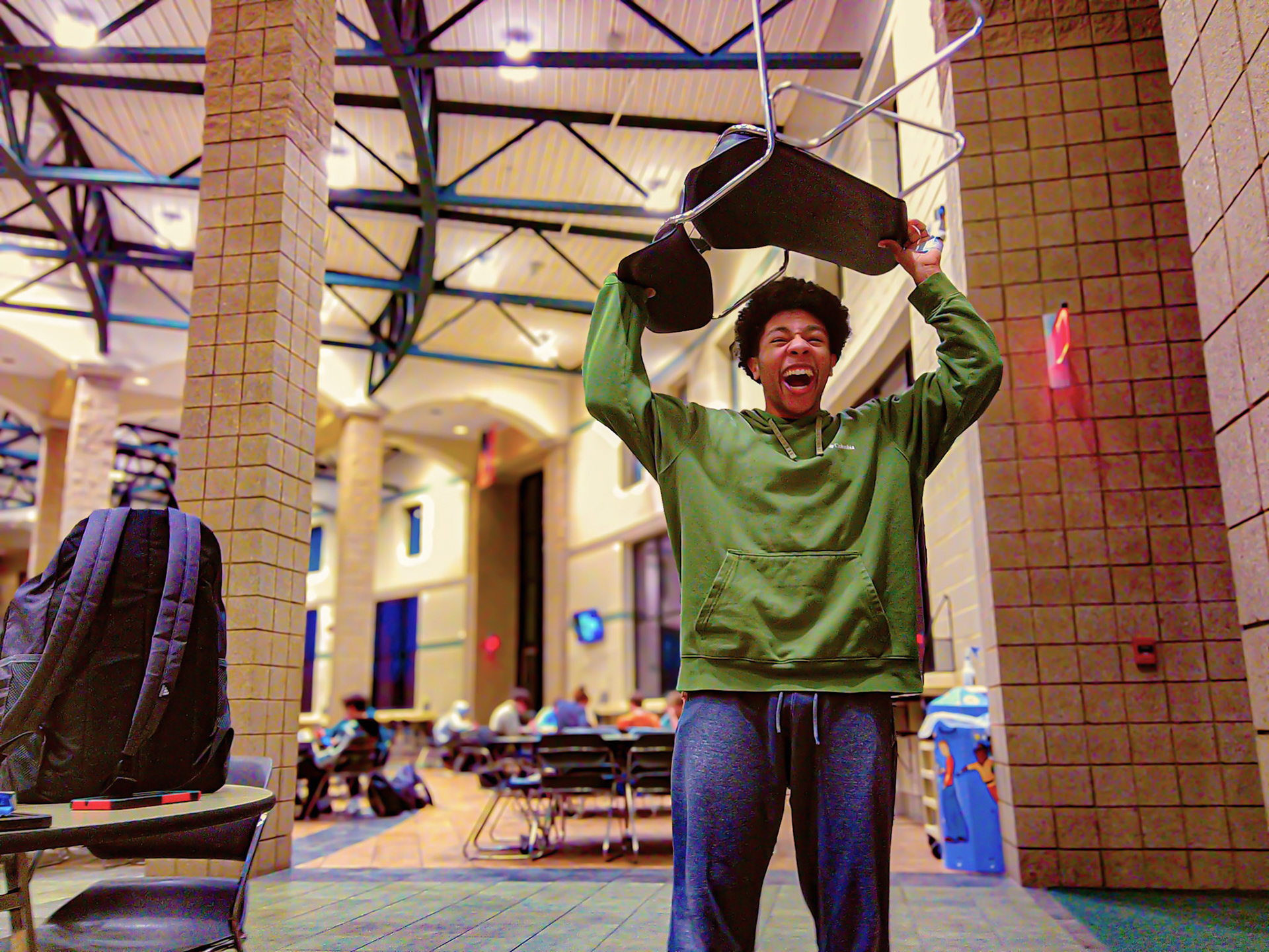 Jacob Dunn holds a chair over his head because he is a Barbarian. (Photo by Joseph Dunn)