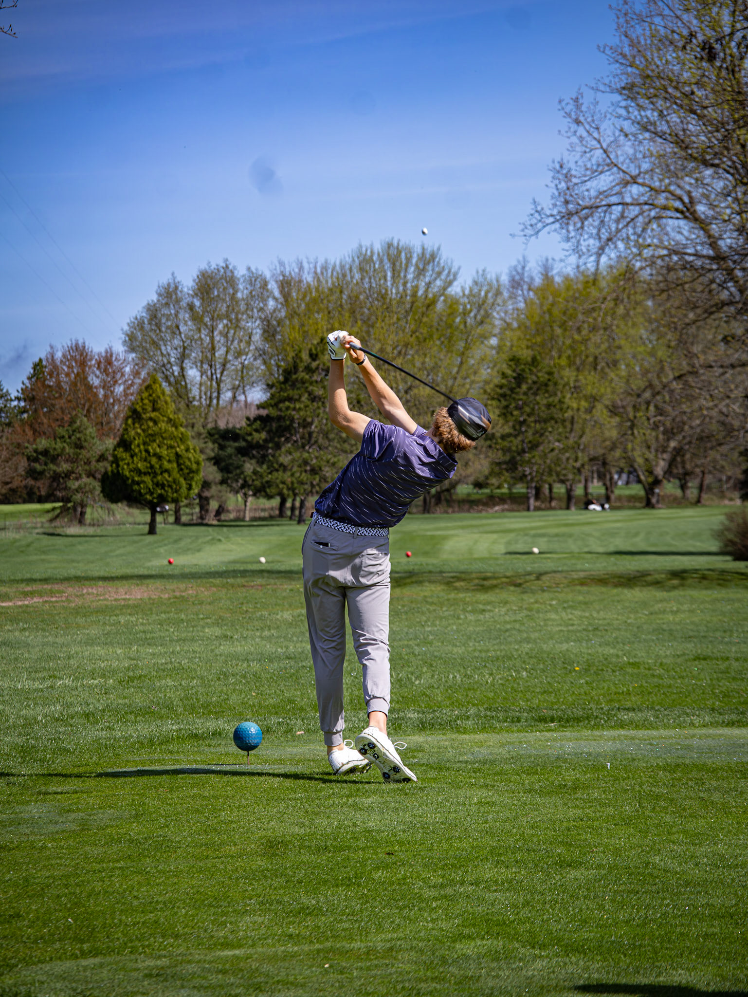 Evan Standley smashes his drive down the fairway. (Photo by Aaron Pyper)