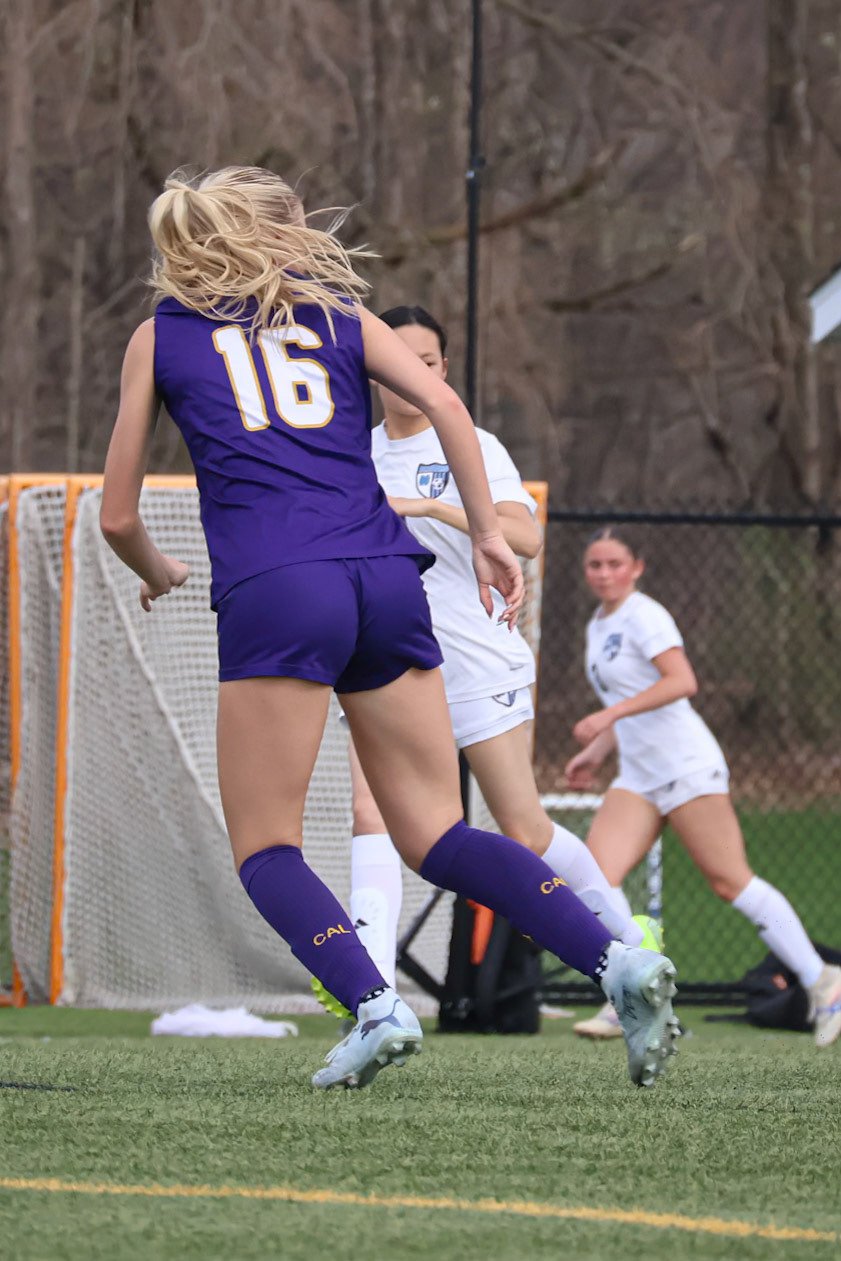Laney Winstrom pushes foward while tracking the ball during the match. (Photo by Emma Garza)