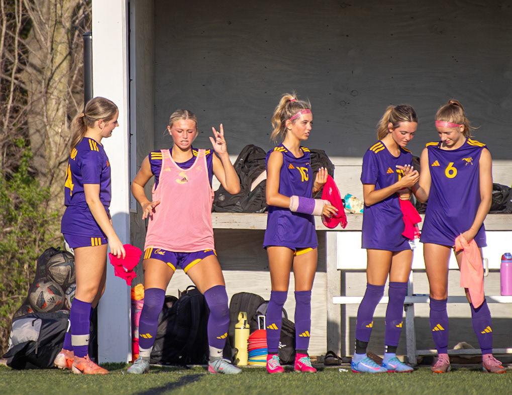 Greeley Gingrich dances on the sideline, soaking in the 10–0 lead early in the first half. (Photo by Aibree Akers)