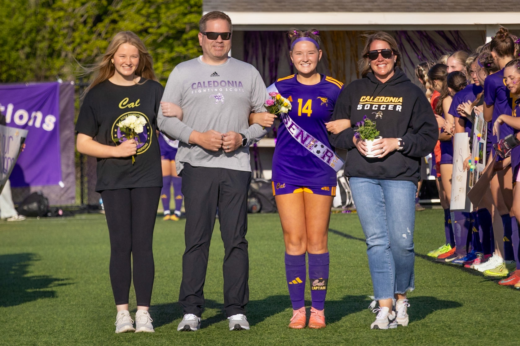 Kortney Muller celebrates Senior Night with her sister Molly and her parents. (Photo by Ava LaBine)