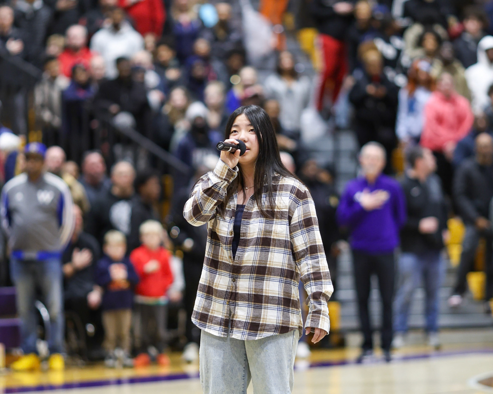Junior Made Mai performs the national anthem at the MHSAA Boys Basketball Finals between East Kentwood and Northview. A regular at Caledonia athletic events, she has also been featured at the Amway River Bank Run junior event and a West Michigan Whitecaps game.(Photo by Chris Robotham)