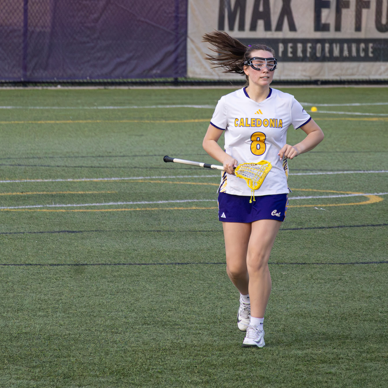 Morgan Barthel jogs into position to defend against a Grand Haven attacker. (Photo by Keira Marshall)