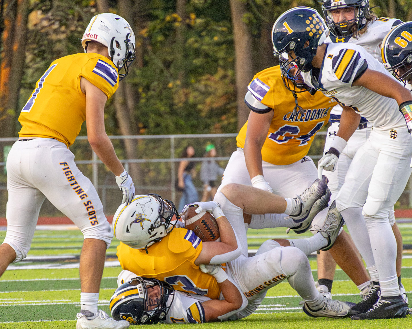 Ryne Wysocki  fights through the defense but gets tackled at the 27-yard line. (Photo by Taya Penoes)
