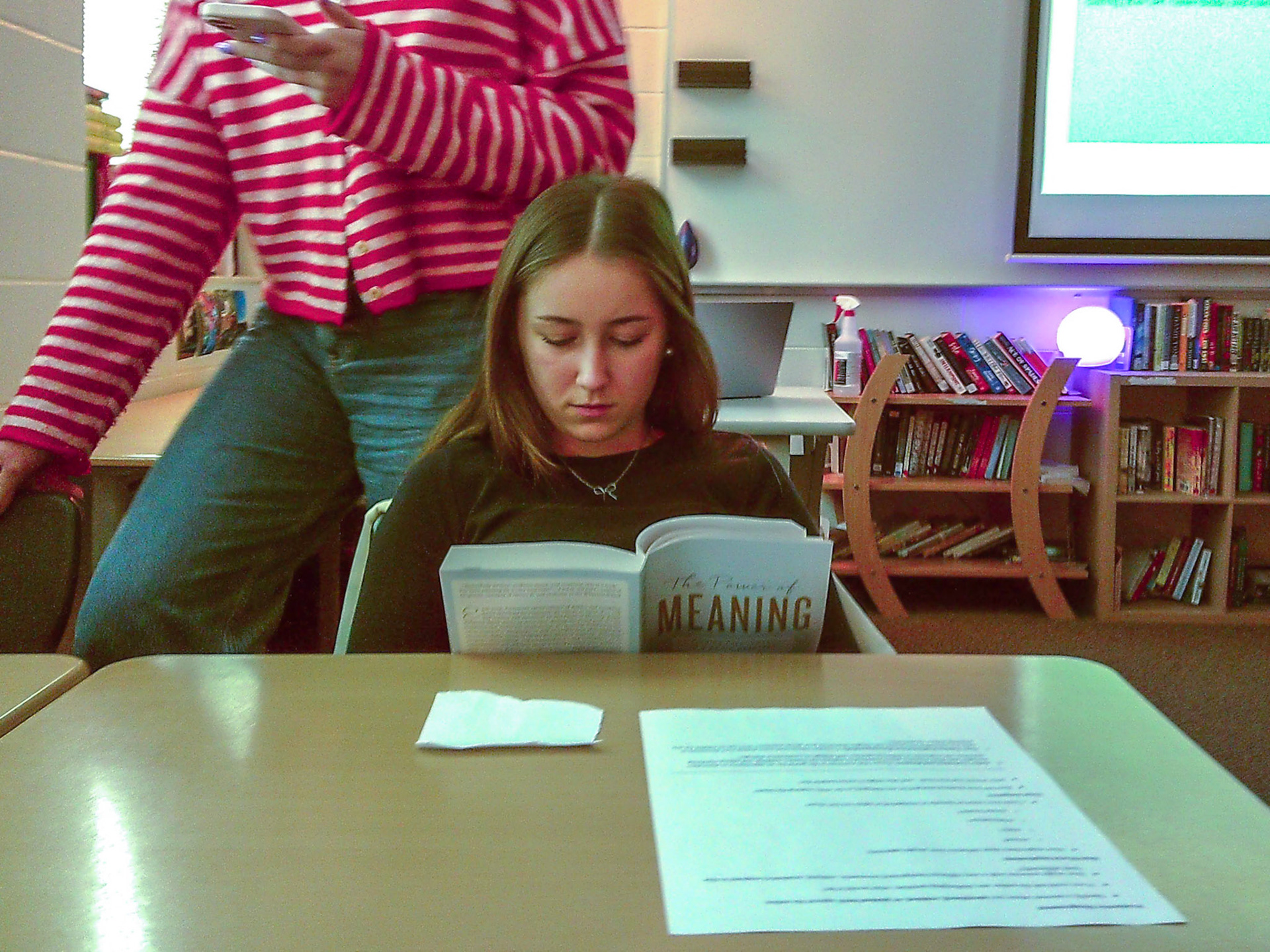 During silent reading time, Alma Cortes Diaz prepares for her book club discussion on Thursday. (Photo by Ella-Grace Wickens)