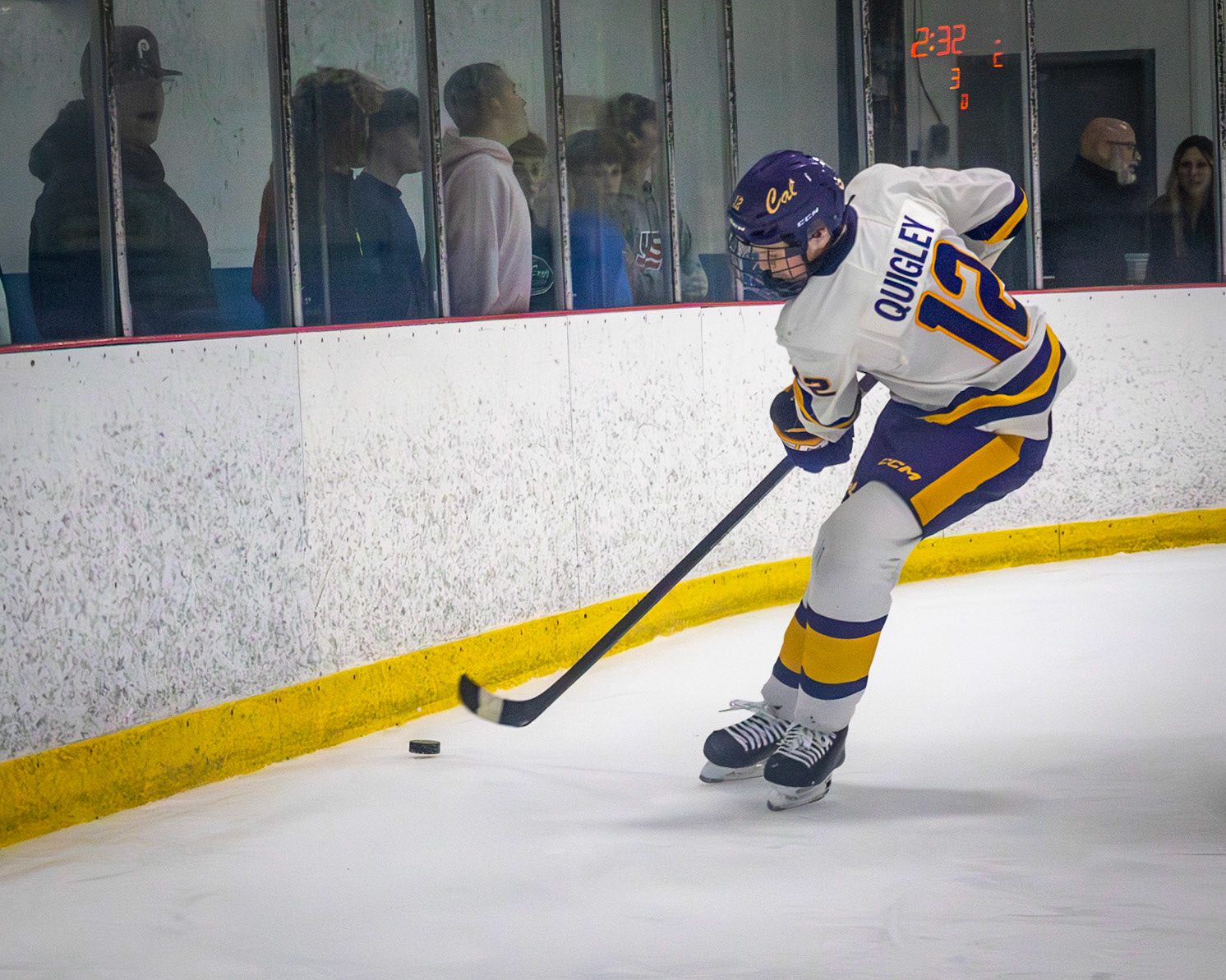Chasing down the puck Camden Quigley brings the puck behind the goal hoping to find an open teammate on the other side. (Photo by Ella-Grace Wickens)