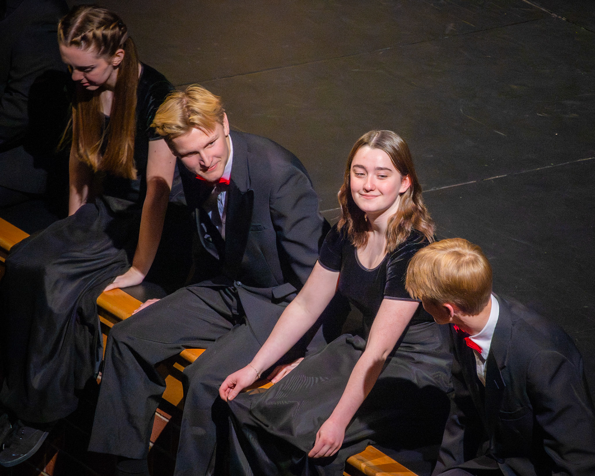 Allison Malone, Connor Parlin, Lydia Shoesmith, and Christian Moorlag share a moment of encouragement before starting Have Yourself a Merry Little Christmas, with Connor in the middle leading the start. (Photo by Valentina Sosa)