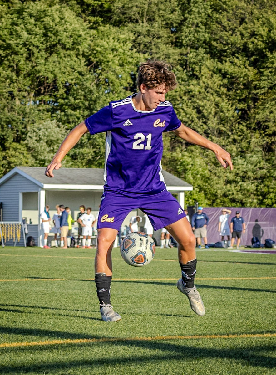 Corbin Ryder shows quick reflexes as he snags the ball right between his legs, stopping the play in its tracks. (Photo by Akaela Daman)