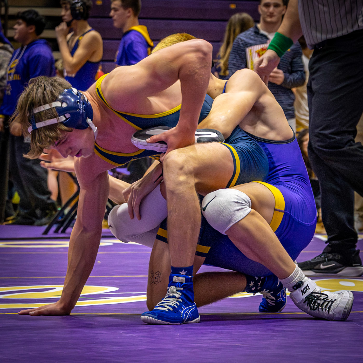 Escher Reeder wraps up his opponent and scores for Caledonia. (Photo by Rhyan Guzman)