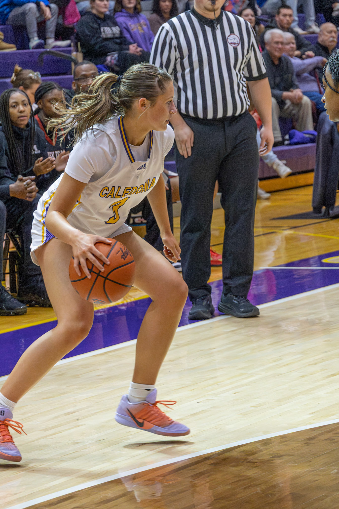 COURT VISION Olivia Foster controls the dribble as she surveys the floor in the Muskegon matchup. (Photo by Taya Penoes)