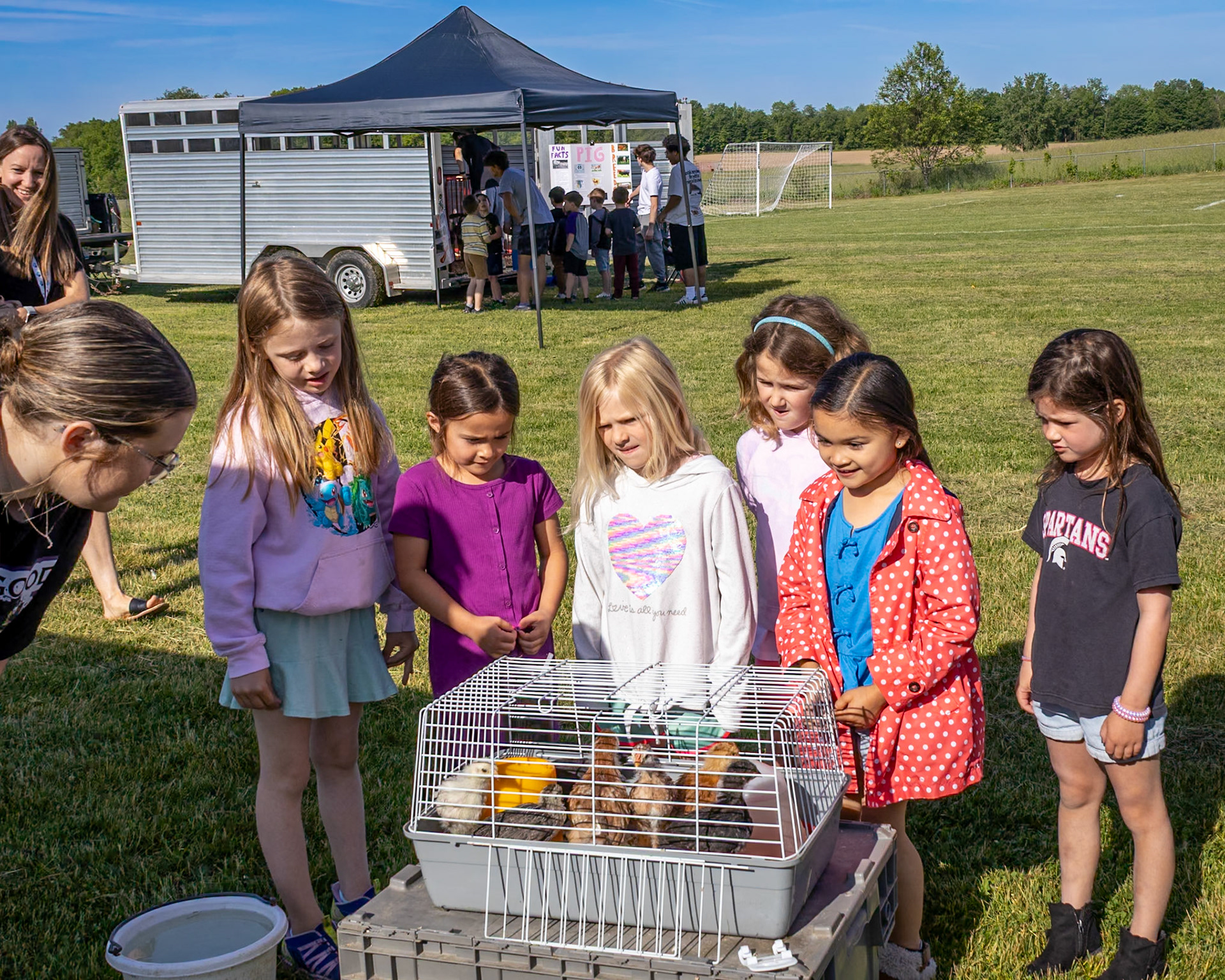 Students gather around a display of chicks at Paris Ridge during an Agri-Cal event. (Photo By Landry Mueller)