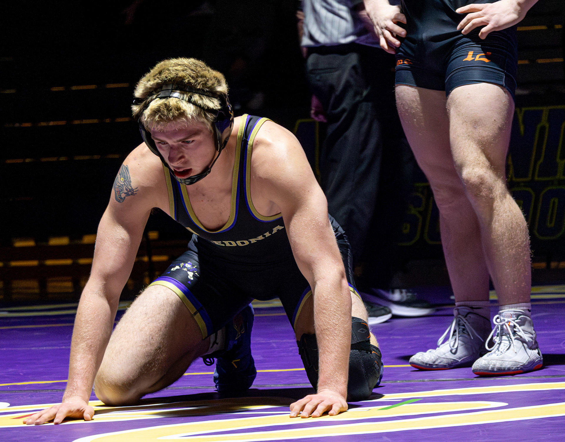Cayden getting set to wrestle jis opponent. (Photo by Ellie VanderRoest)