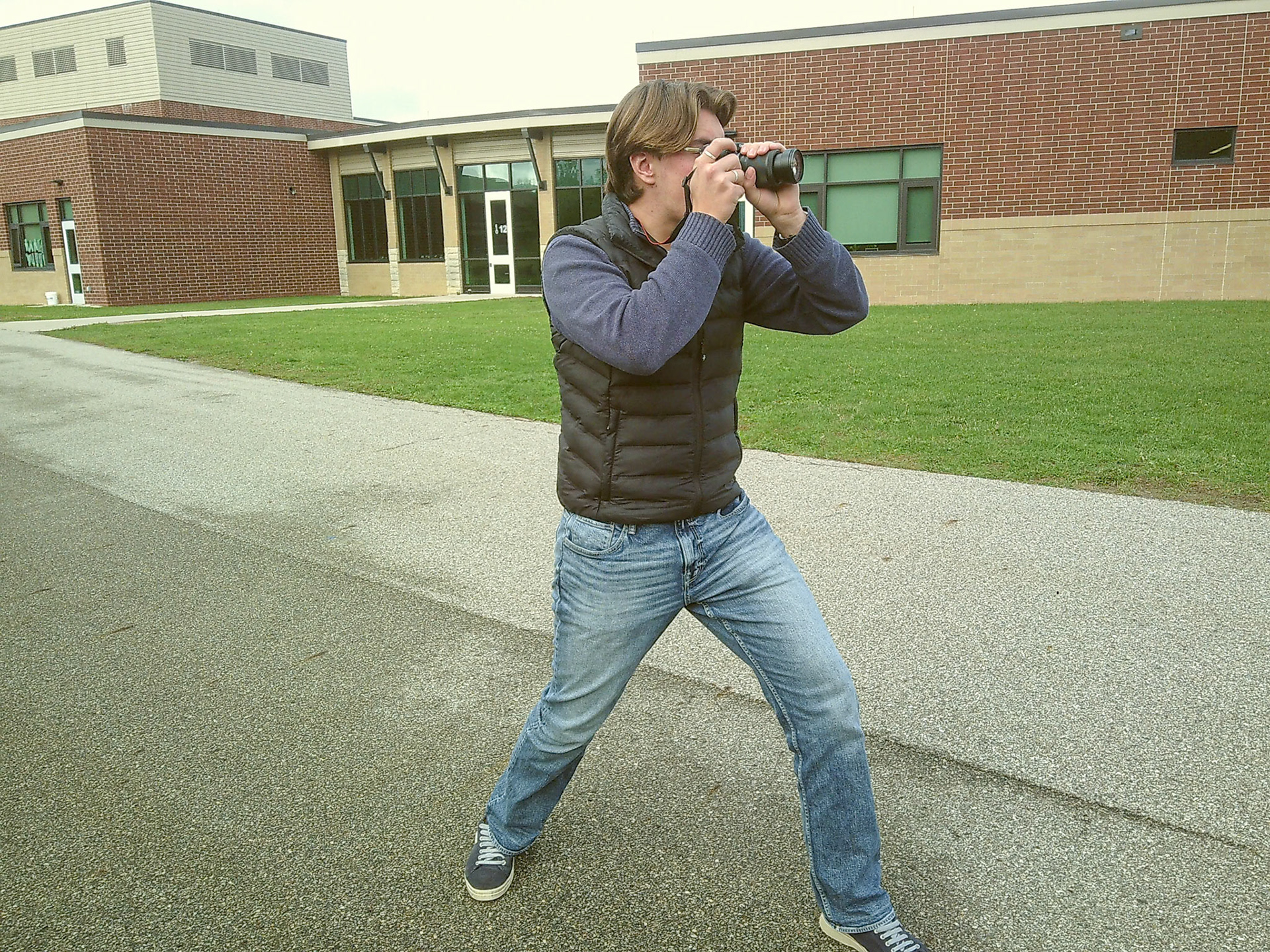 Love Lindqvist gets in position to photograph Laura Harder in Digital Art and Photography class. (Photo by Lena Gesing)