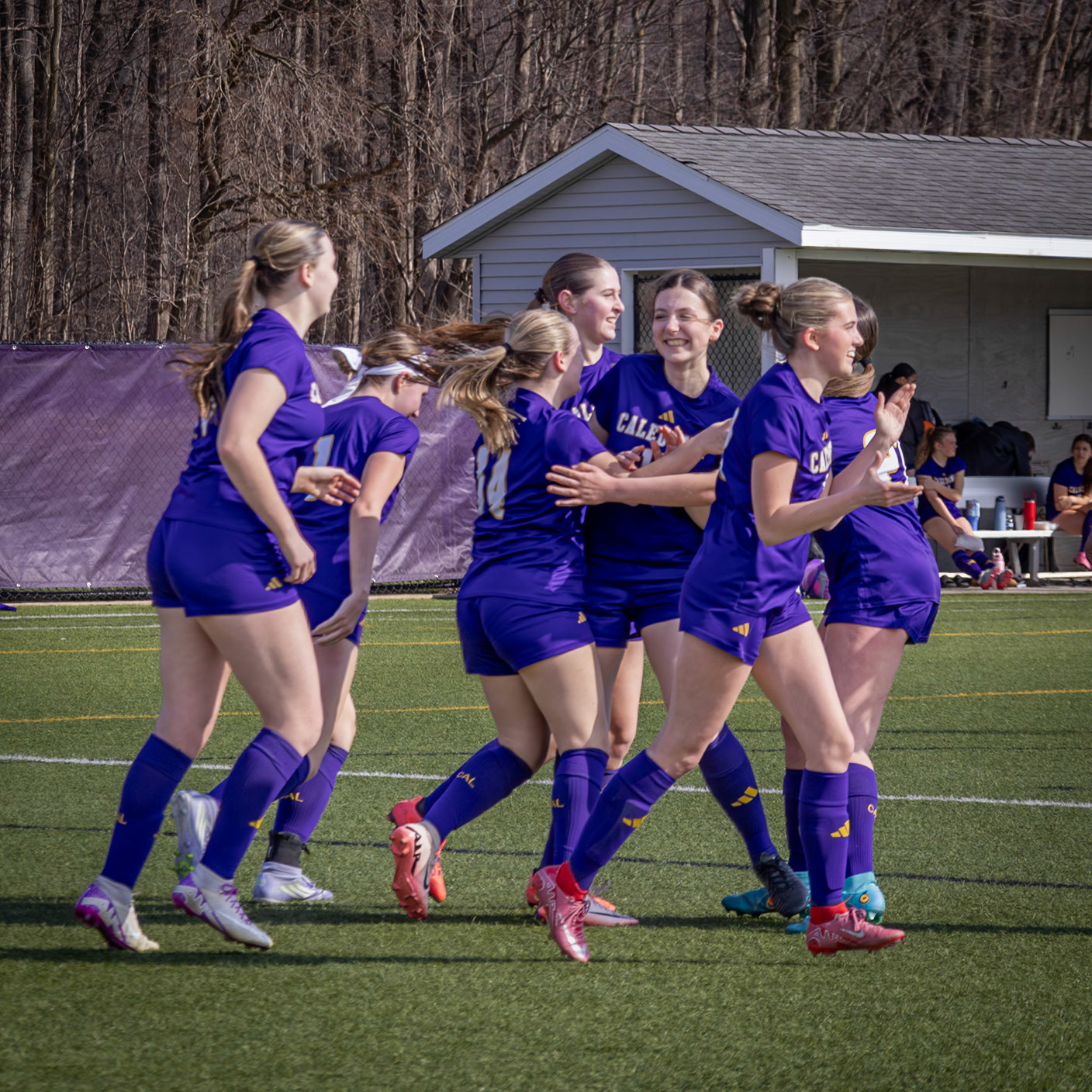 Teammates celebrate with Ava Leach after her goal. (Photo by Sophie Grajewski)