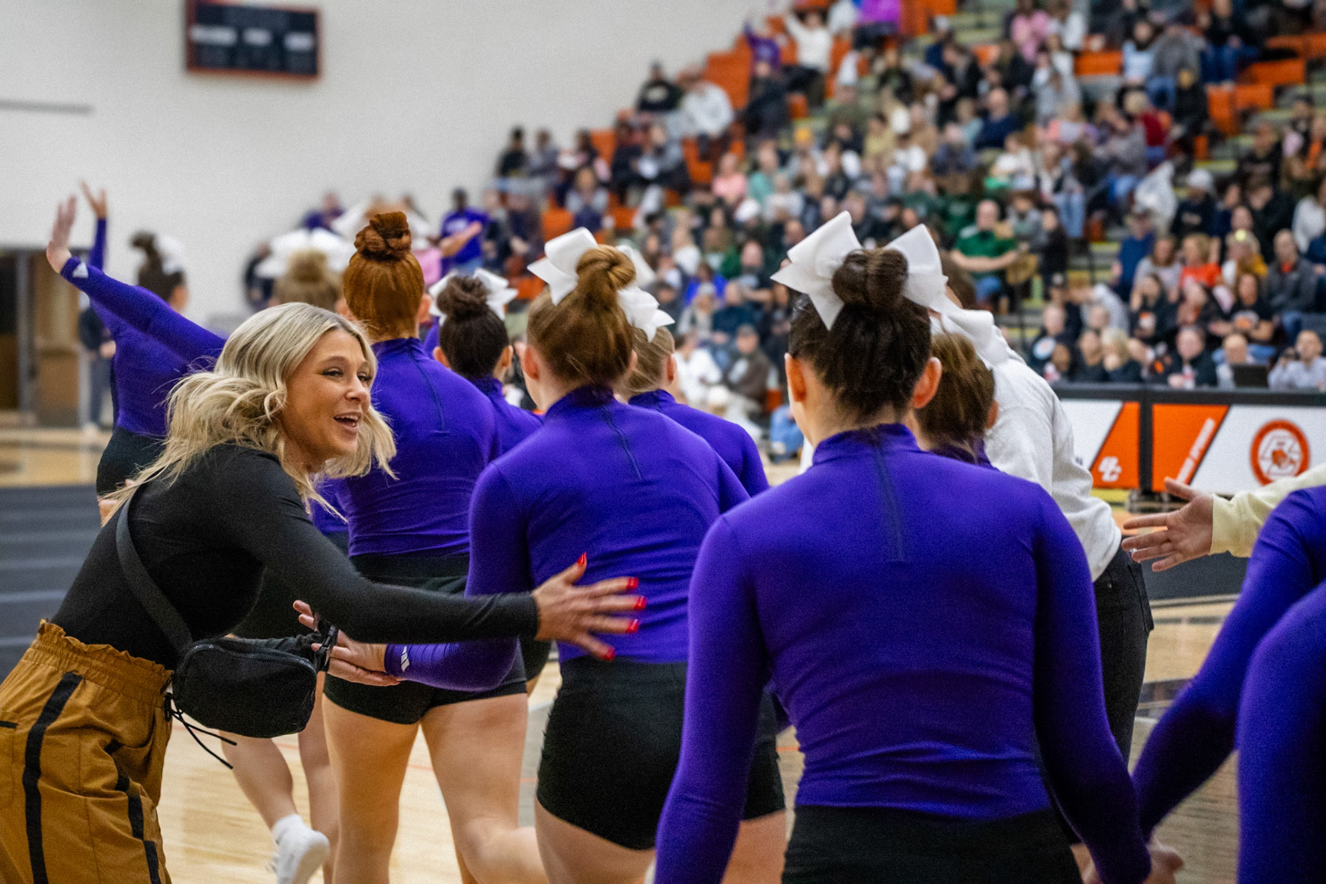 Last words of encouragement from the coach before stepping onto the mat. (Photo by Addie Visel)