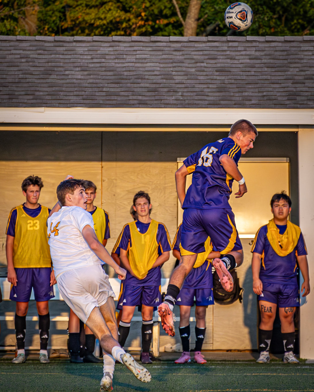 Mason Lapekes leaps to make a header during play. (Photo by Milana Rico)