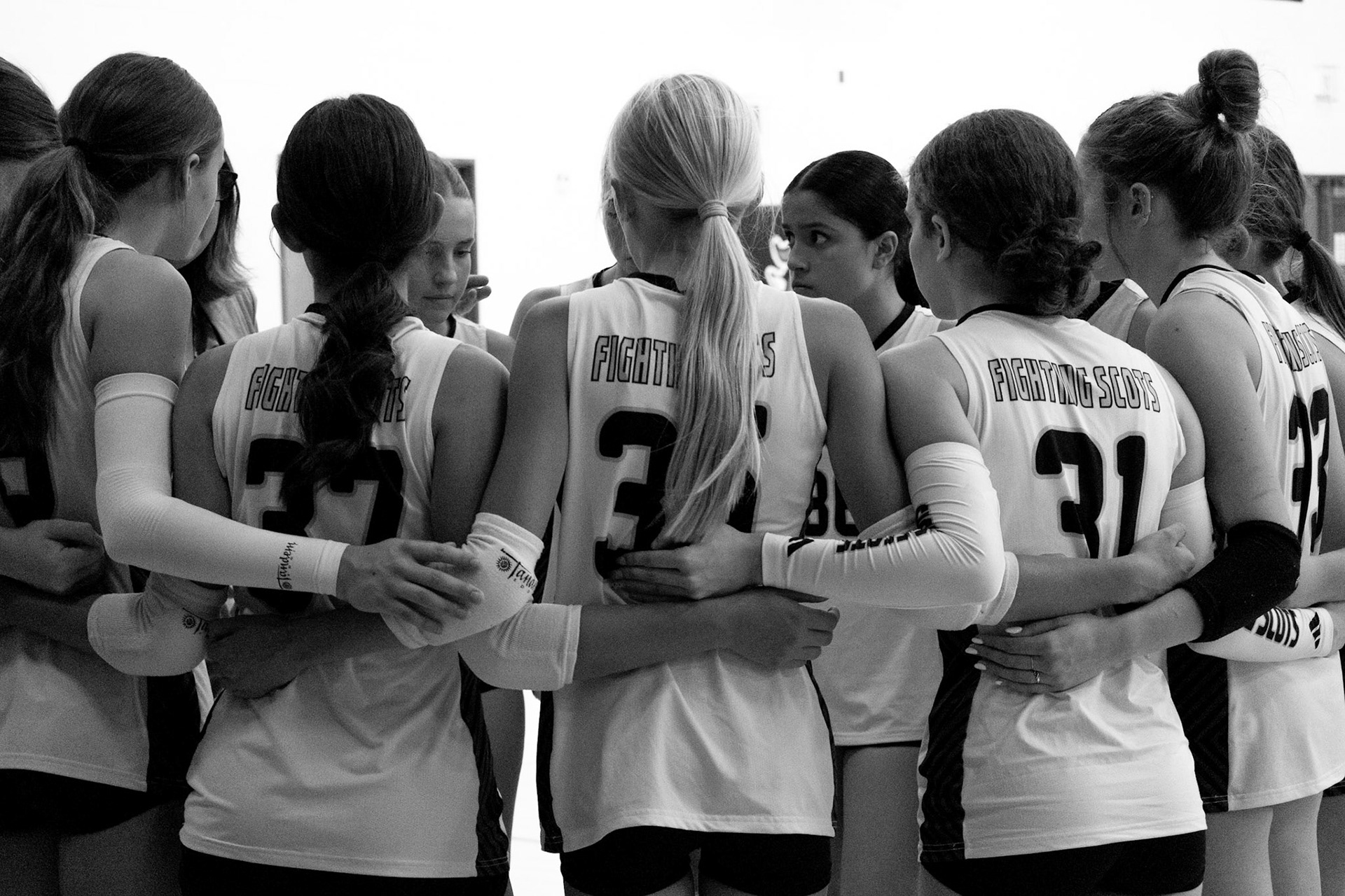 Our Freshman volleyball team breaks to hear valuable feedback from Coach. (Photo by Elsha Bytwork)