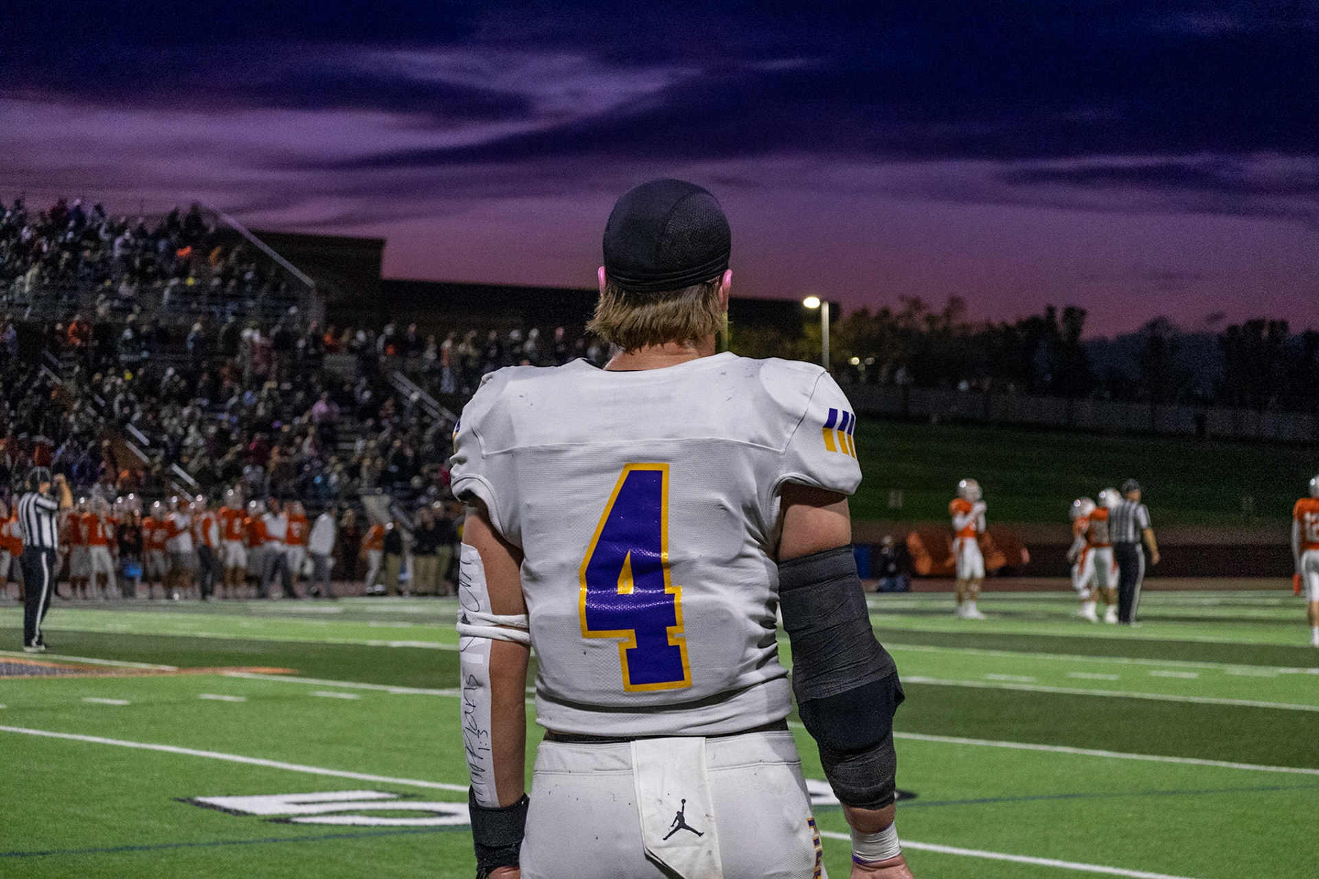 FIELD OF VISION  Elliot Clark watches the game against Rockford unfold under a purple sky. (Photo by Avarey Lippert)