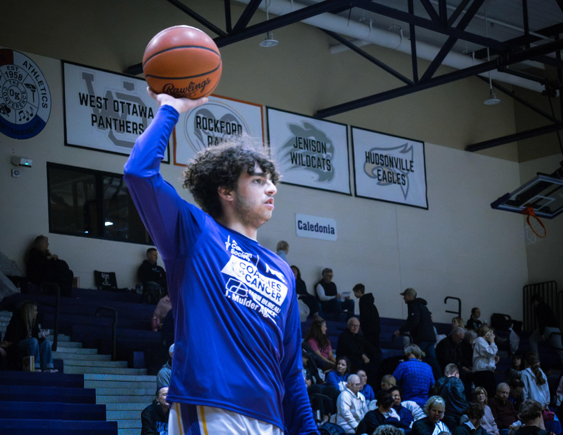 Malachi Hanson warms up before Senior Night. (Photo by Aaron Pyper)