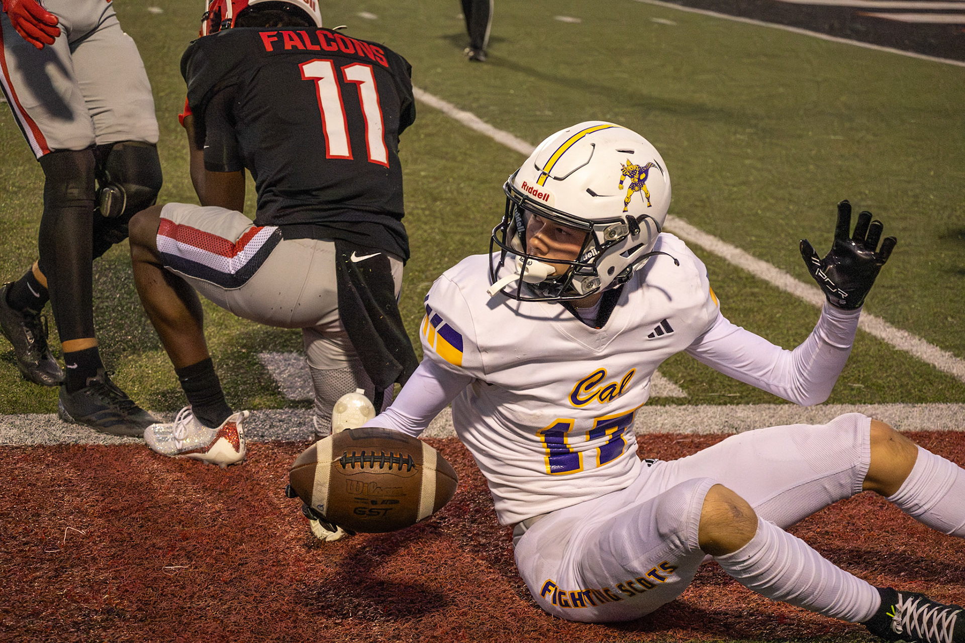 EYES ON OFFICIALS  Miles Grengs looks at the referees, football in hand after being forced to the sidelines by an East Kentwood player. (Photo by Avarey Lippert)