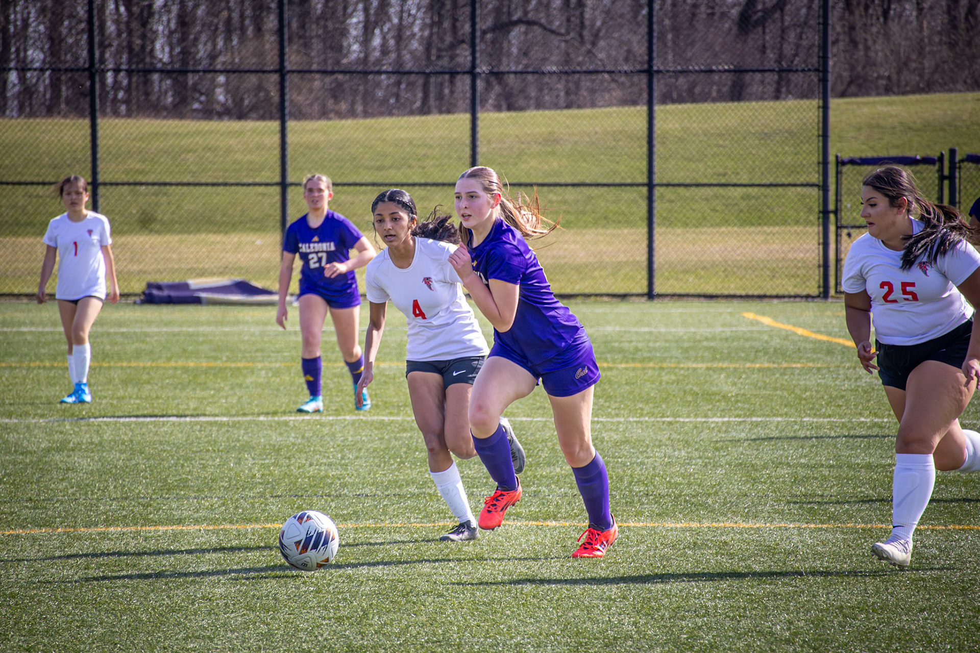 MacKenzi Price battles an opponent for possession. (Photo by Sophie Grajewski)