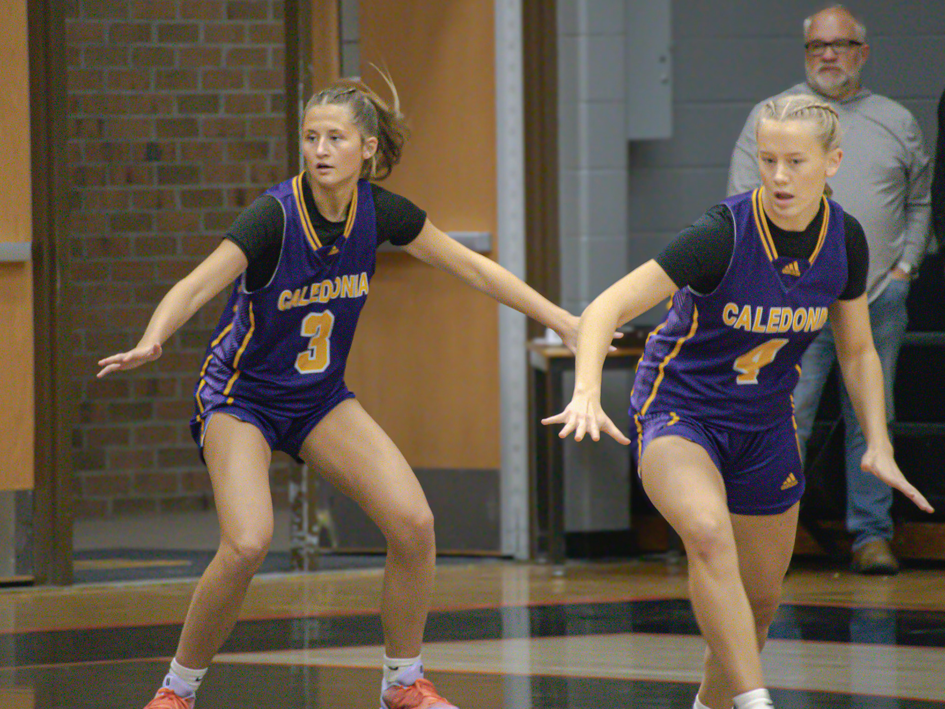 Sophmores Olivia Foster and Myla Gortmaker in a defensive stance ready to steal the ball from their opponent. (Photo by Kortney Muller)