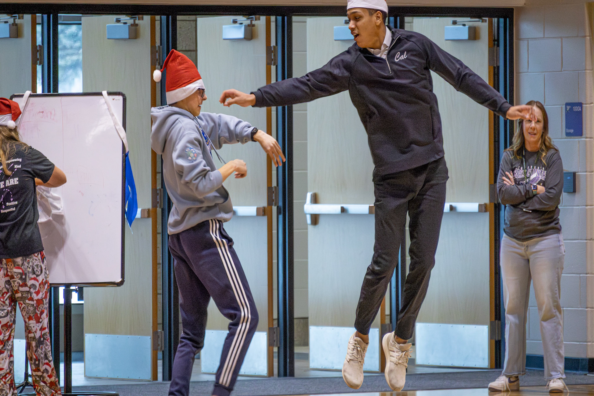 SANTA SNATCHING Gabe Supuk attempts to win the game by grabbomg Nick Amorose's hat. (Photo by Ella-Grace Wickens)