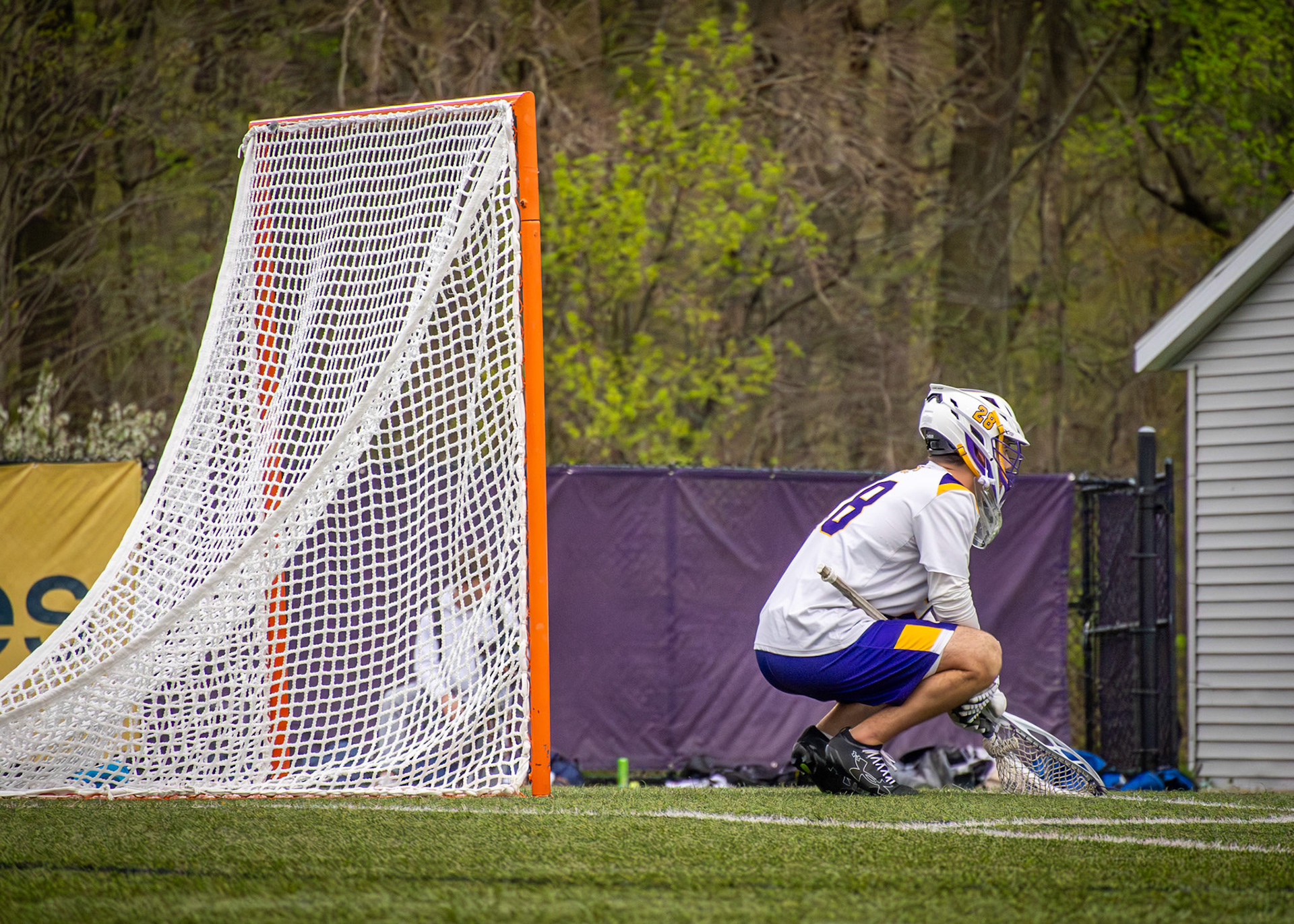 Goalkeeper Landen Moore holds position at the crease, eyes on the play across the field. (Photo by Avarey Lippert)