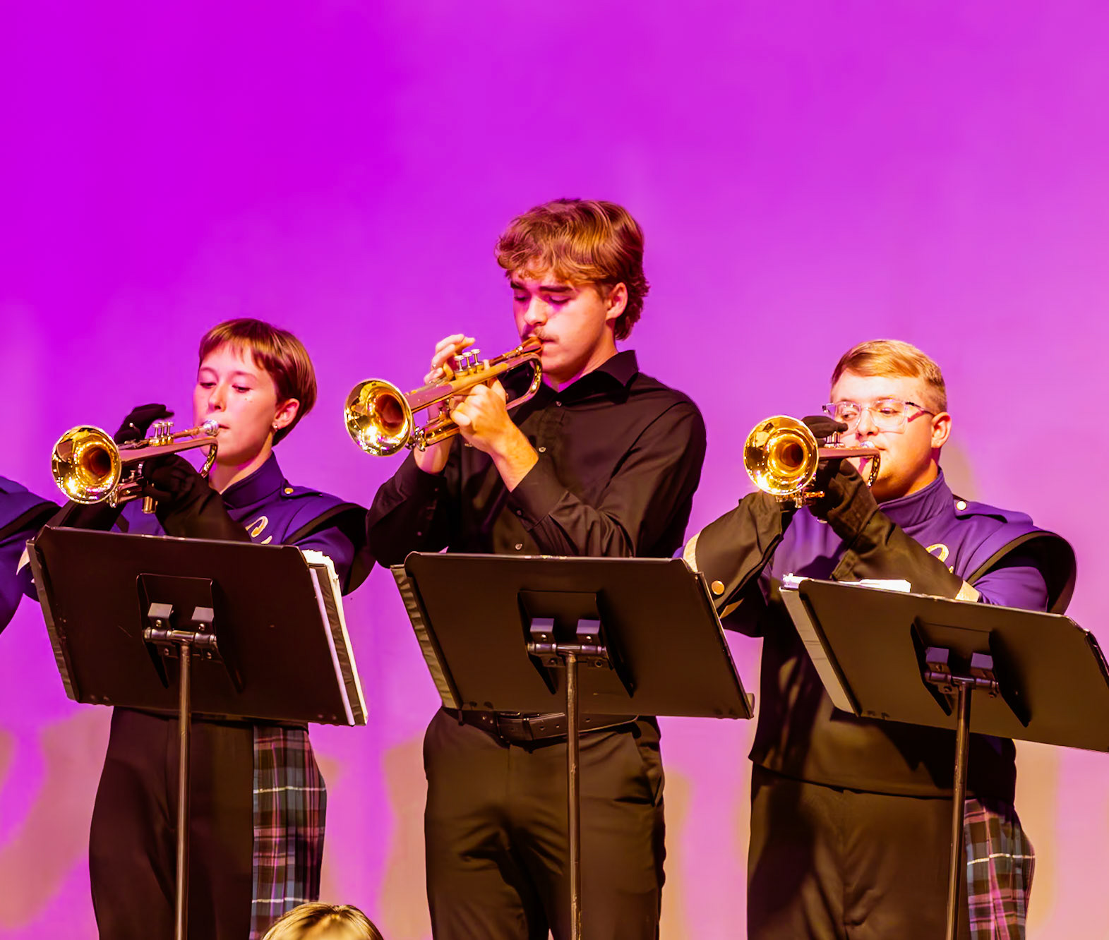 Seniors DJ Robinson, Madelyn Anes, and Brady Humbarger deliver a powerful performance on trumpet, showcasing talent, teamwork, and the bond they’ve built through years of music. (Photo by Molly Larson)