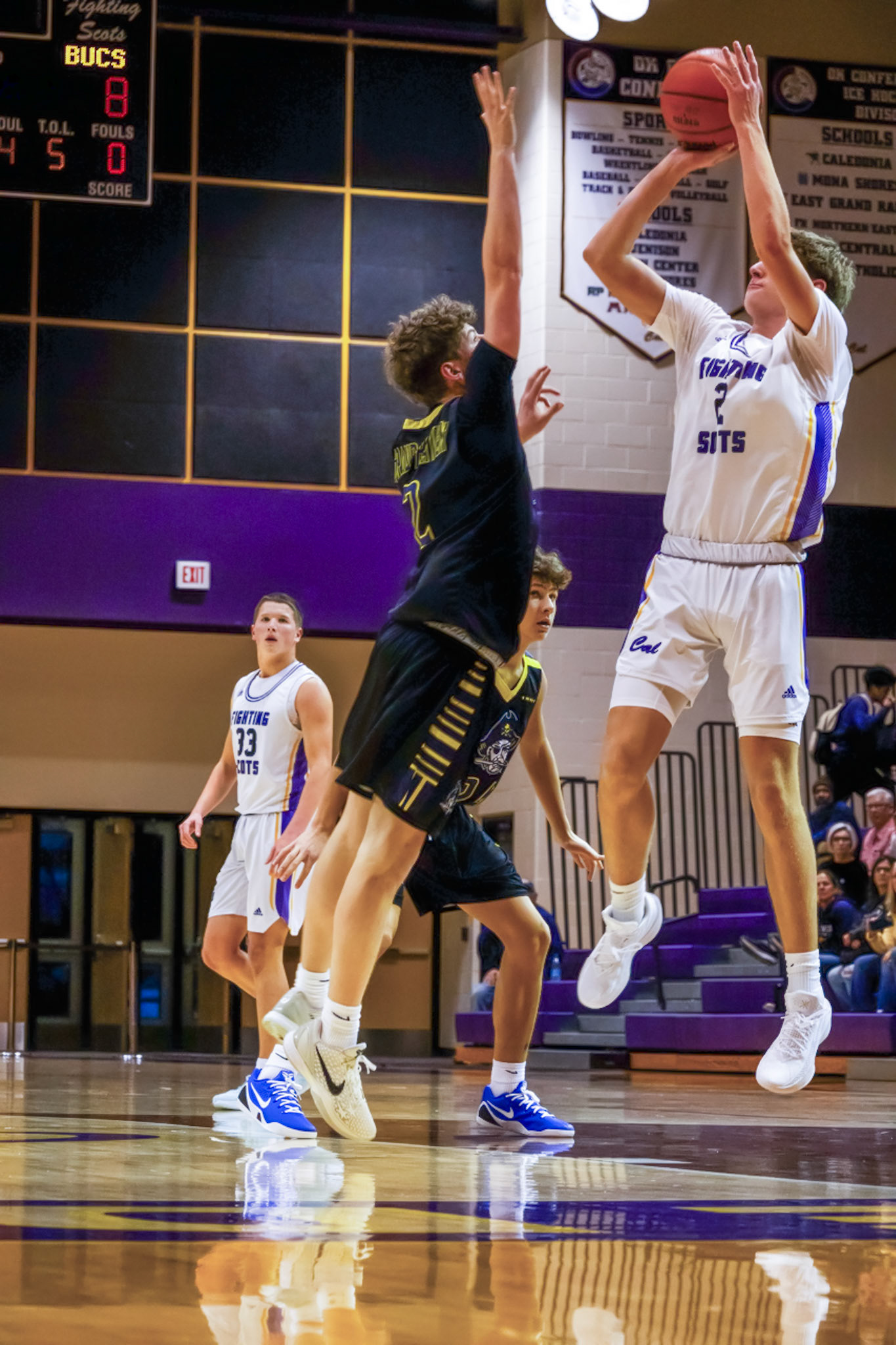Alex Postma elevates for a mid-range jumper over his defender, using his athleticism and height advantage to create space. (Photo by Jeremiah Pittman)