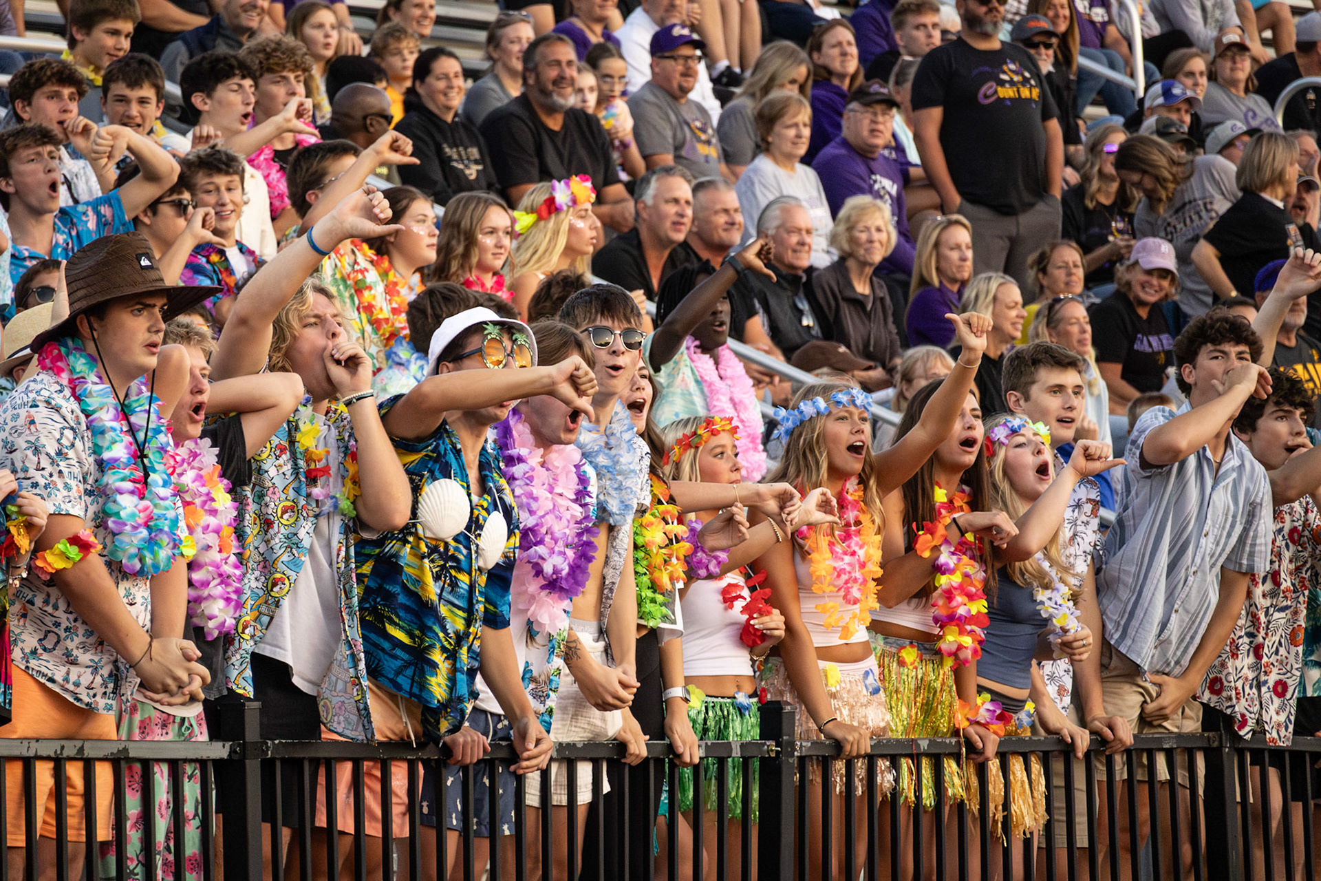 BIG BOO Tropical colors and spirited voices fill the stadium as Caledonia student's express their displeasure at rival East Kentwood's latest move. (Photo by Avarey Lippert)