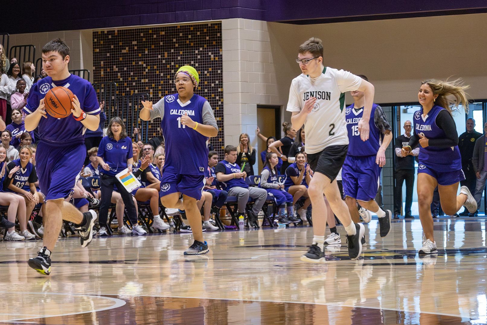 Racing down the court, Ethan Boucher controls the ball while Lydia Casey stands by, ready to assist against any blocks from their opponents. (Photo by Abby Skibinski)