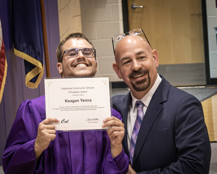 Keagan Yenna smiles with Mr. Martin after being awarded the Prinicpal Award. (Photo by Abigail Douglass)