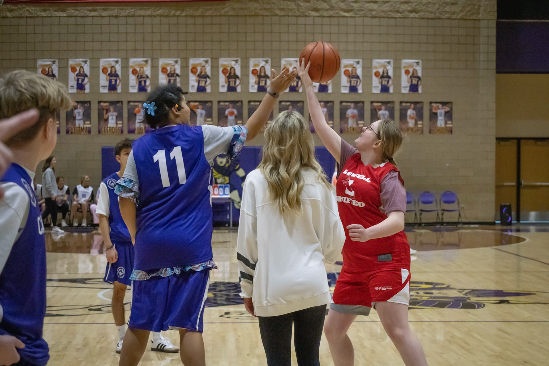 Caledonia's Unified PE class kicks off their first scrimmage against Lowlle with Lydia Casey at the tip off. (Photo by Rhyan Guzman)