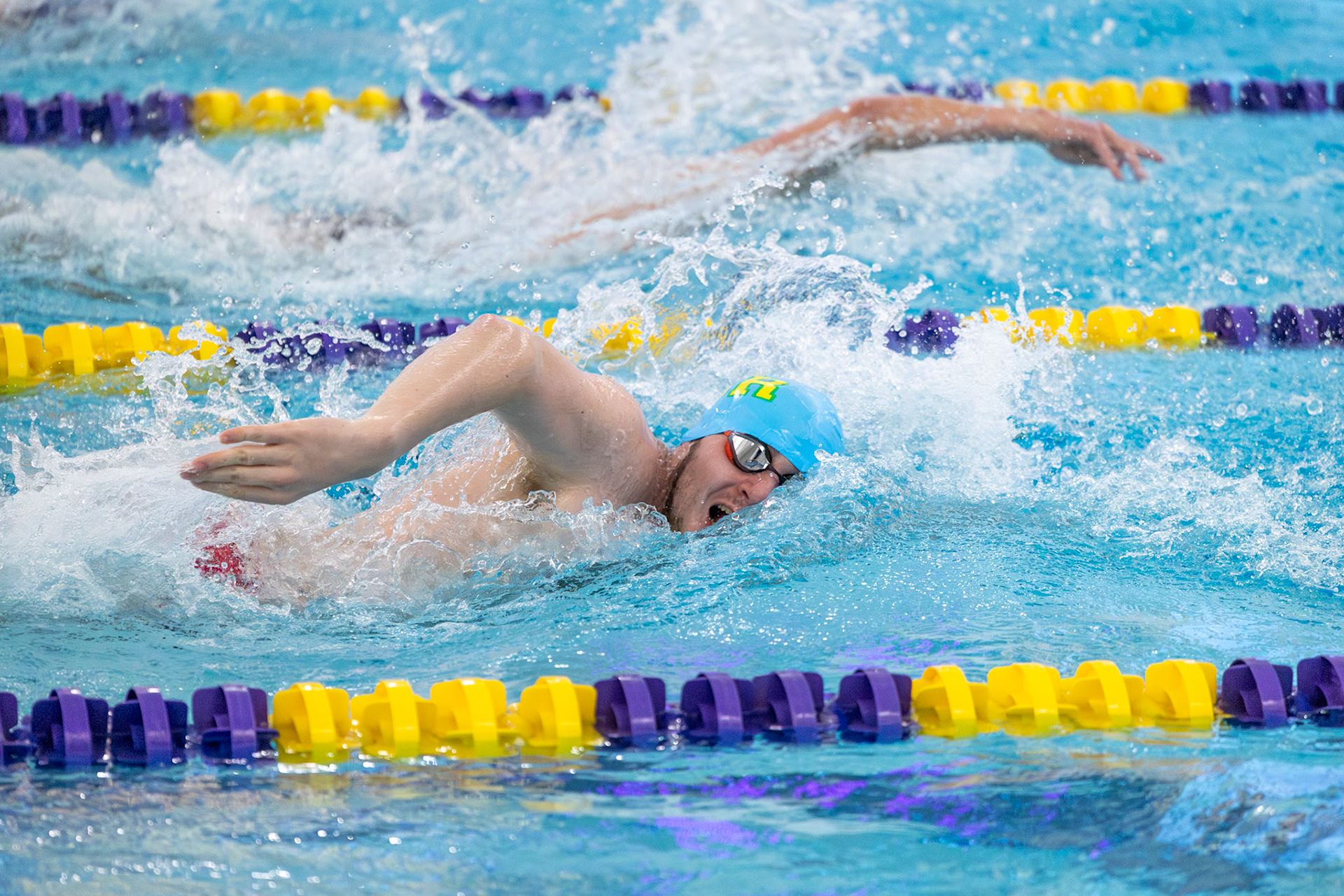 Nolan Fitzgerald attacks the 50-yard freestyle, powering down the pool from the opening signal. (Photo by Hailey Thayer)